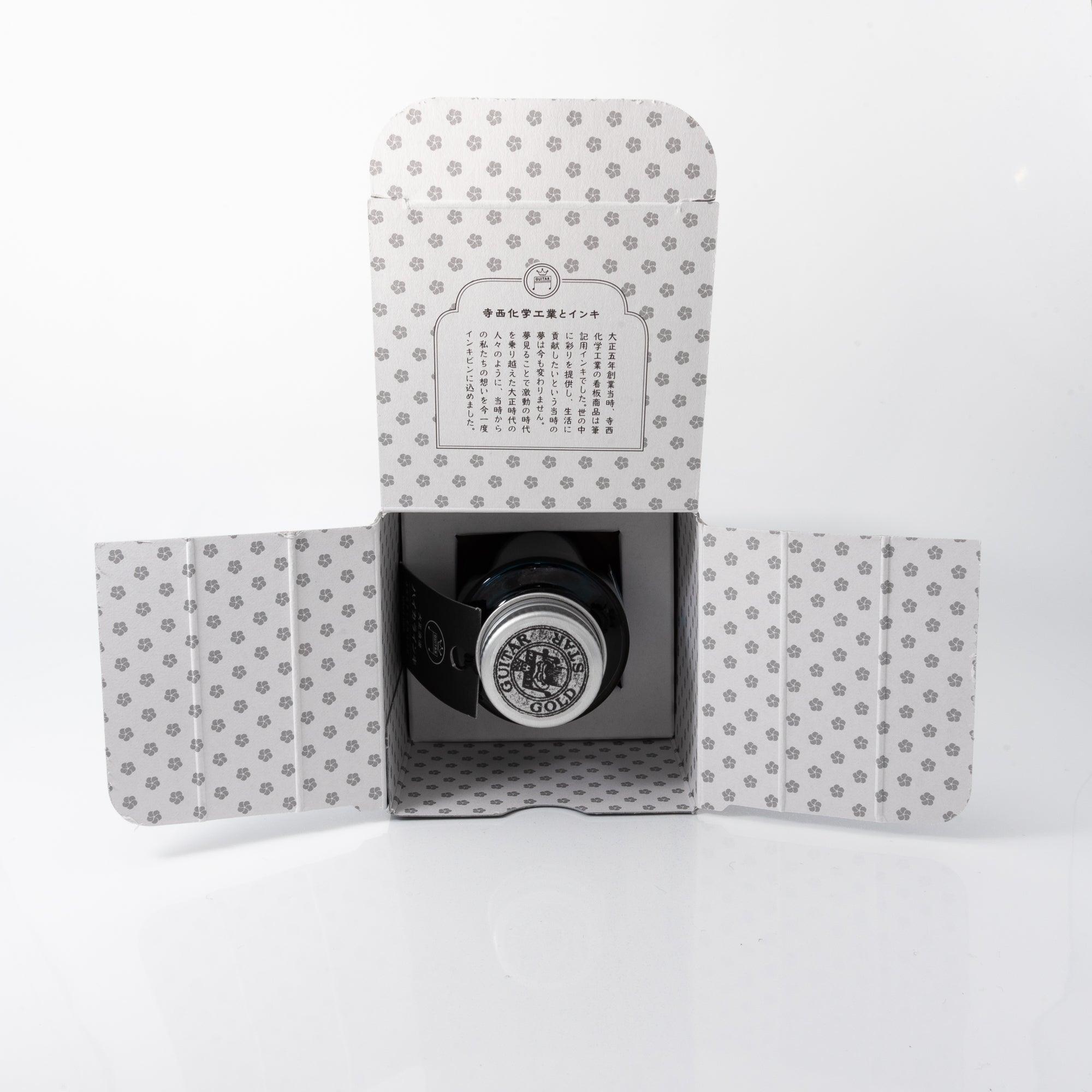 Taisho Romance Lady Emerald ink bottle with cap removed, revealing its luminous green ink, merging vintage aesthetics with usability.