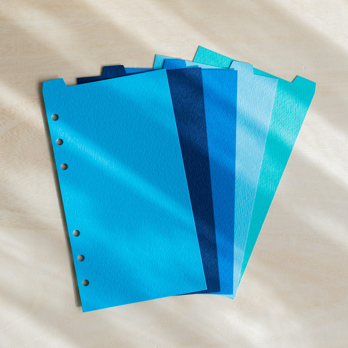 Five Mermaid Bible dividers fanned in sky blue, navy, cobalt, pale blue and turquoise with top tabs