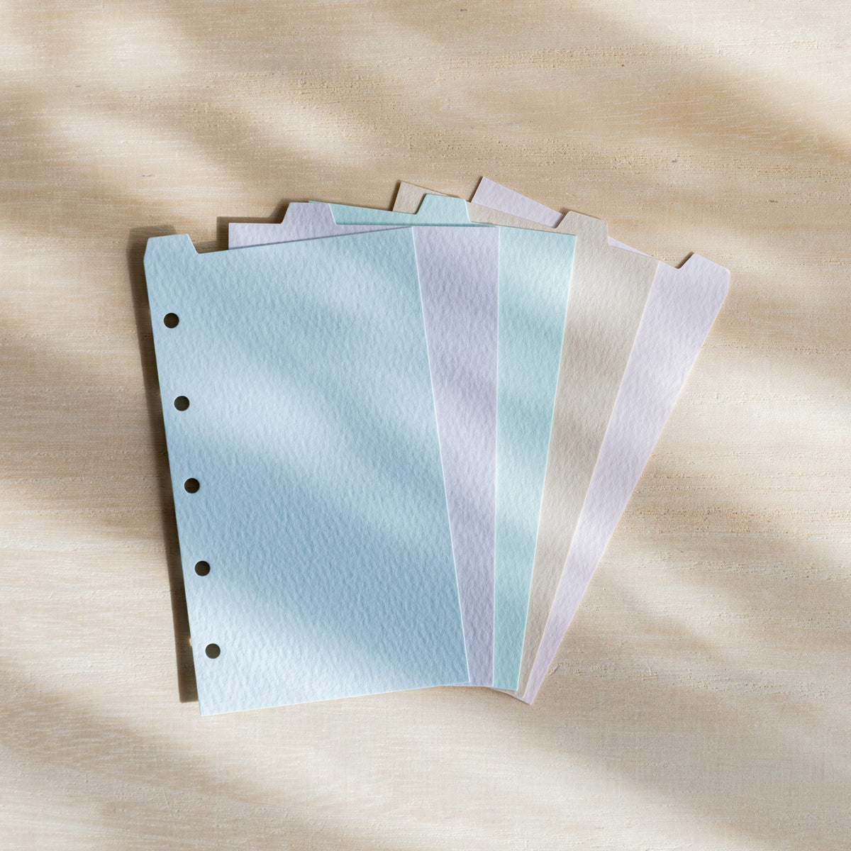 Five Mermaid M5 index dividers fanned in powder blue, lavender, light aqua, ecru and petal pink with top tabs
