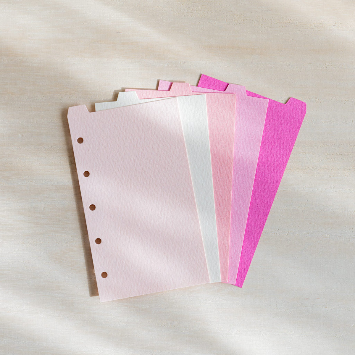 Five Mermaid M5 dividers fanned in pale pink, natural, coral, rose and cosmos pink with top tabs