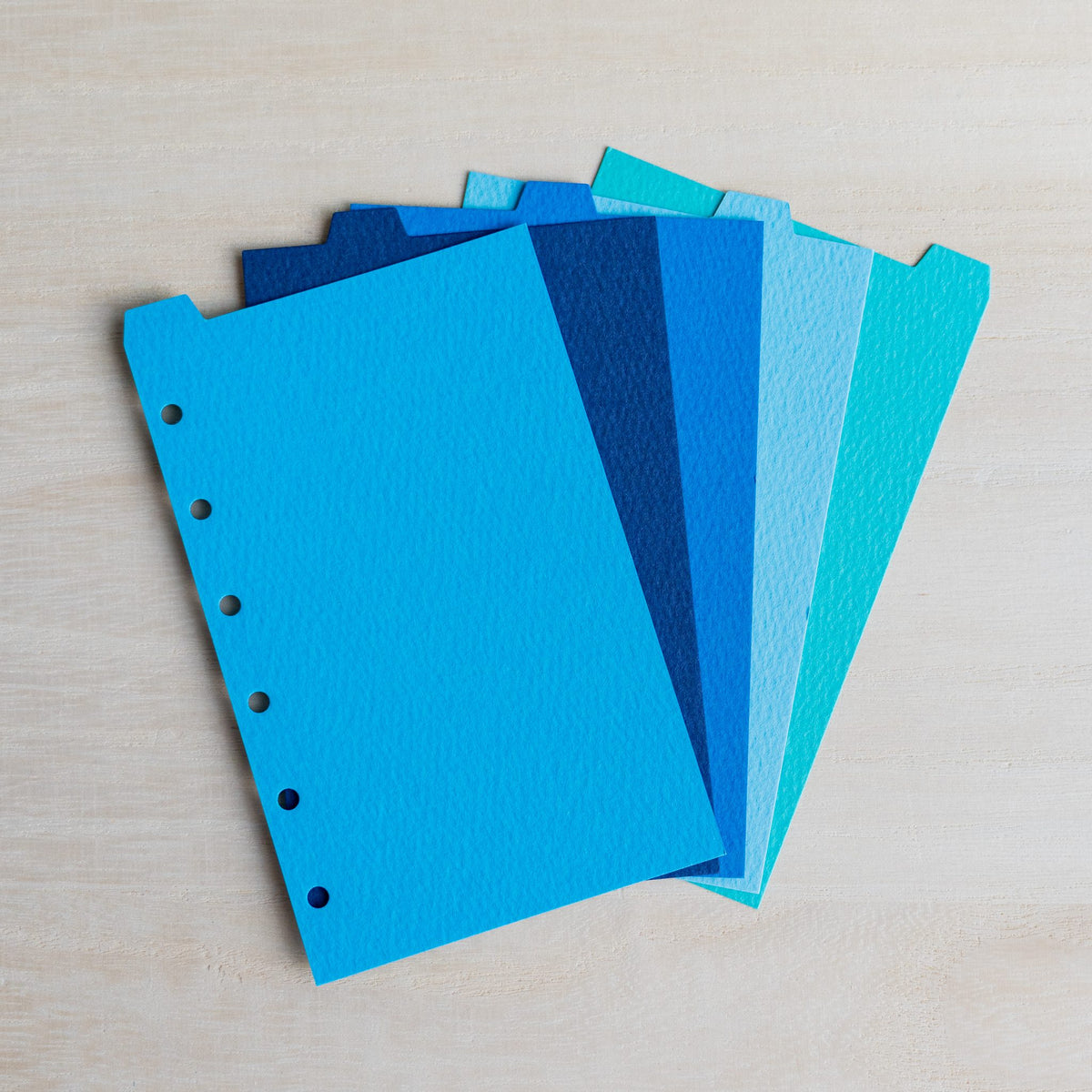 Five Mermaid Mini 6 dividers fanned in sky blue, navy, cobalt, pale blue and turquoise with top tabs