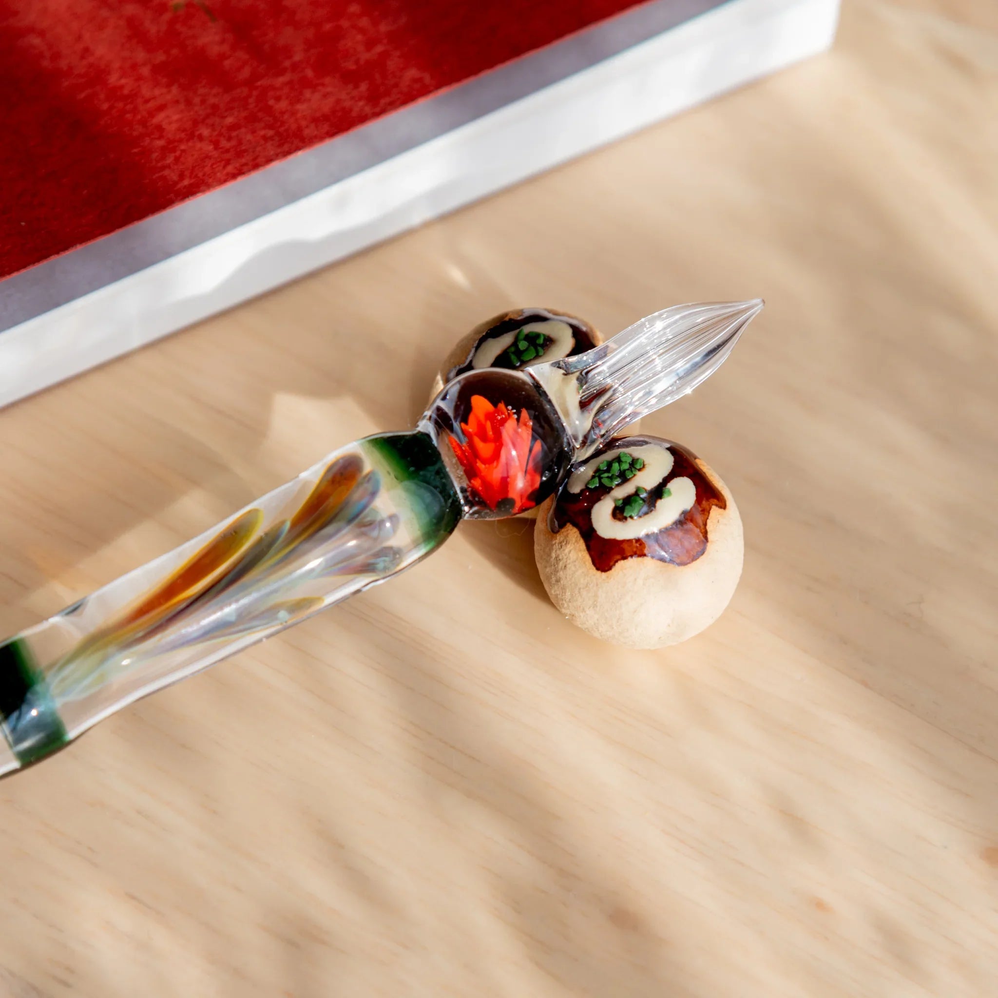 Takoyaki handcrafted ceramic pen rest brown Japanese with rounded ball shape and detailed texture work close shot