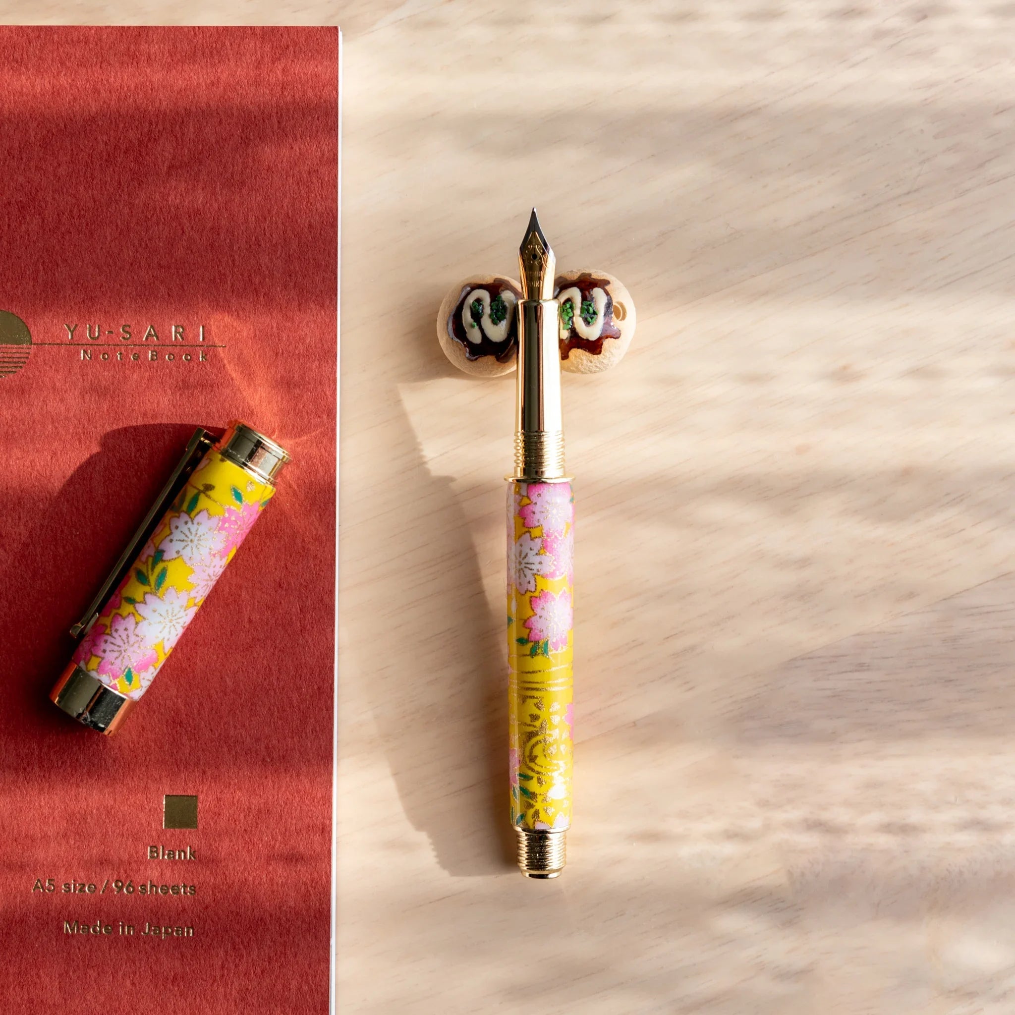 Takoyaki ceramic pen rest handcrafted brown Japanese with textured octopus ball design and surface detail detail