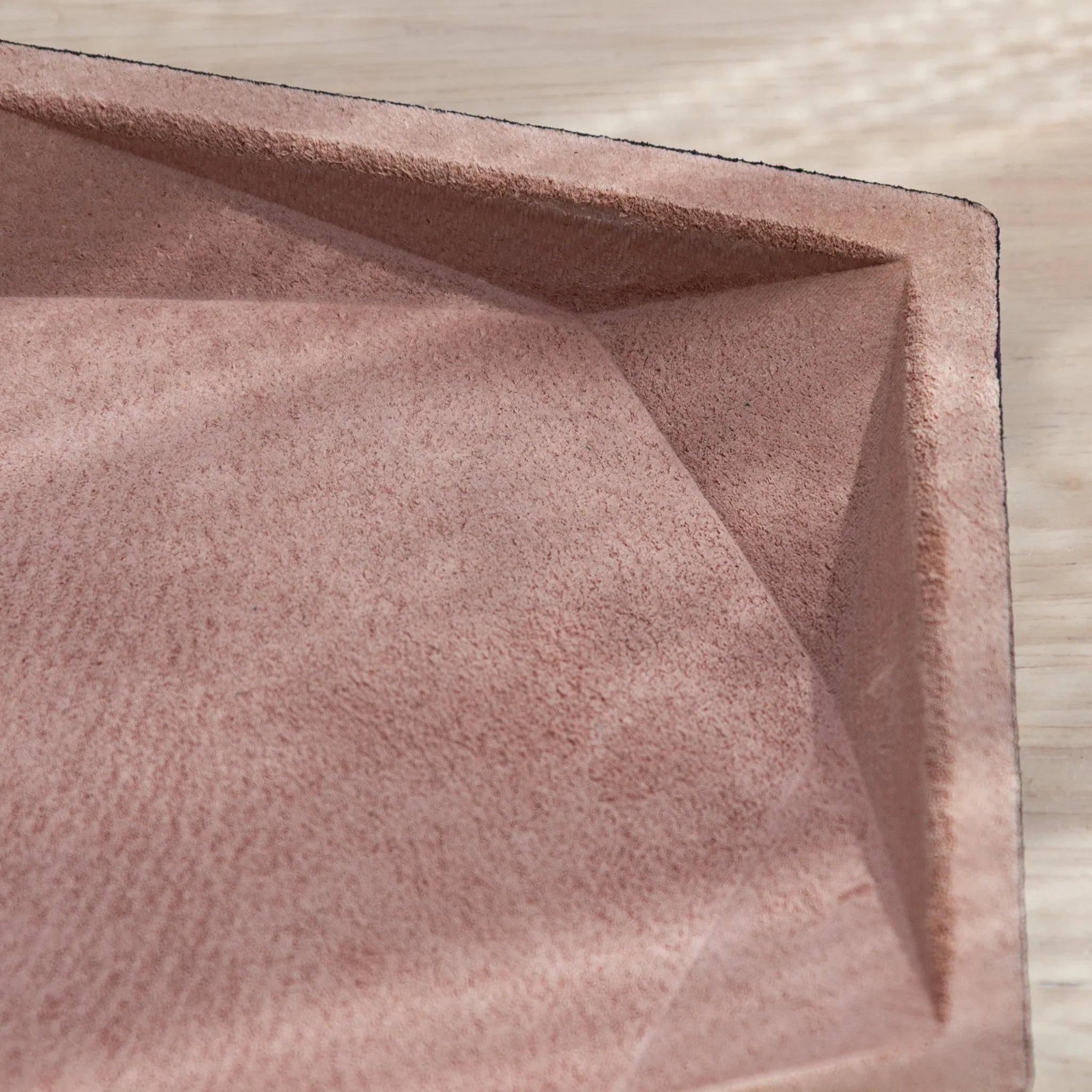 Corner detail of Japanese Pen Tray showing pink suede texture.