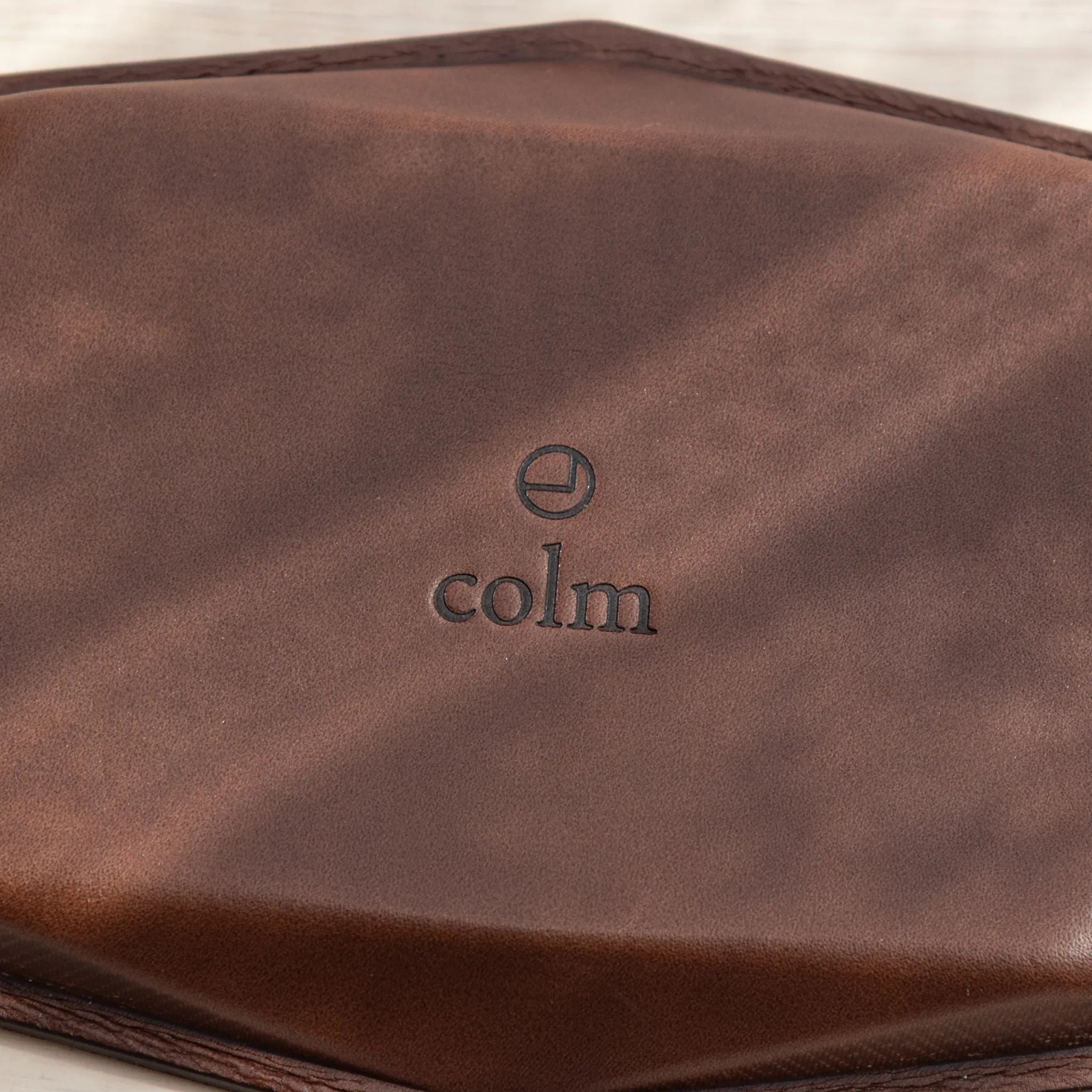 Embossed colm logo on leather back of Japanese Pen Tray.