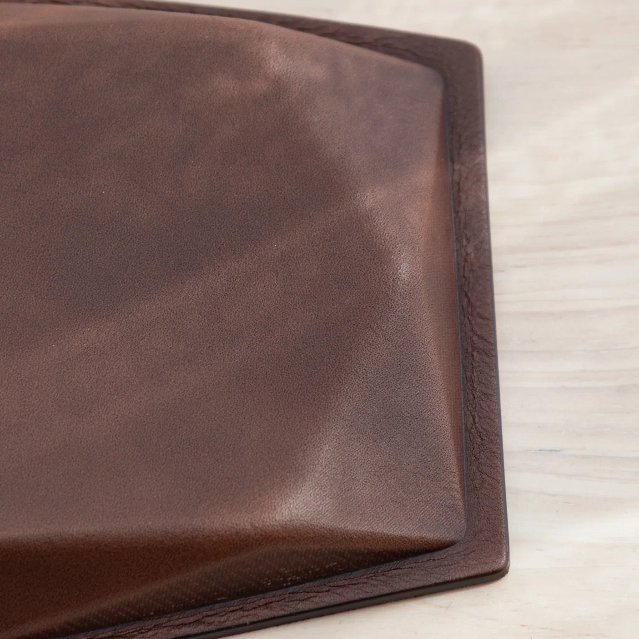 Side detail of brown leather back of Japanese Pen Tray.