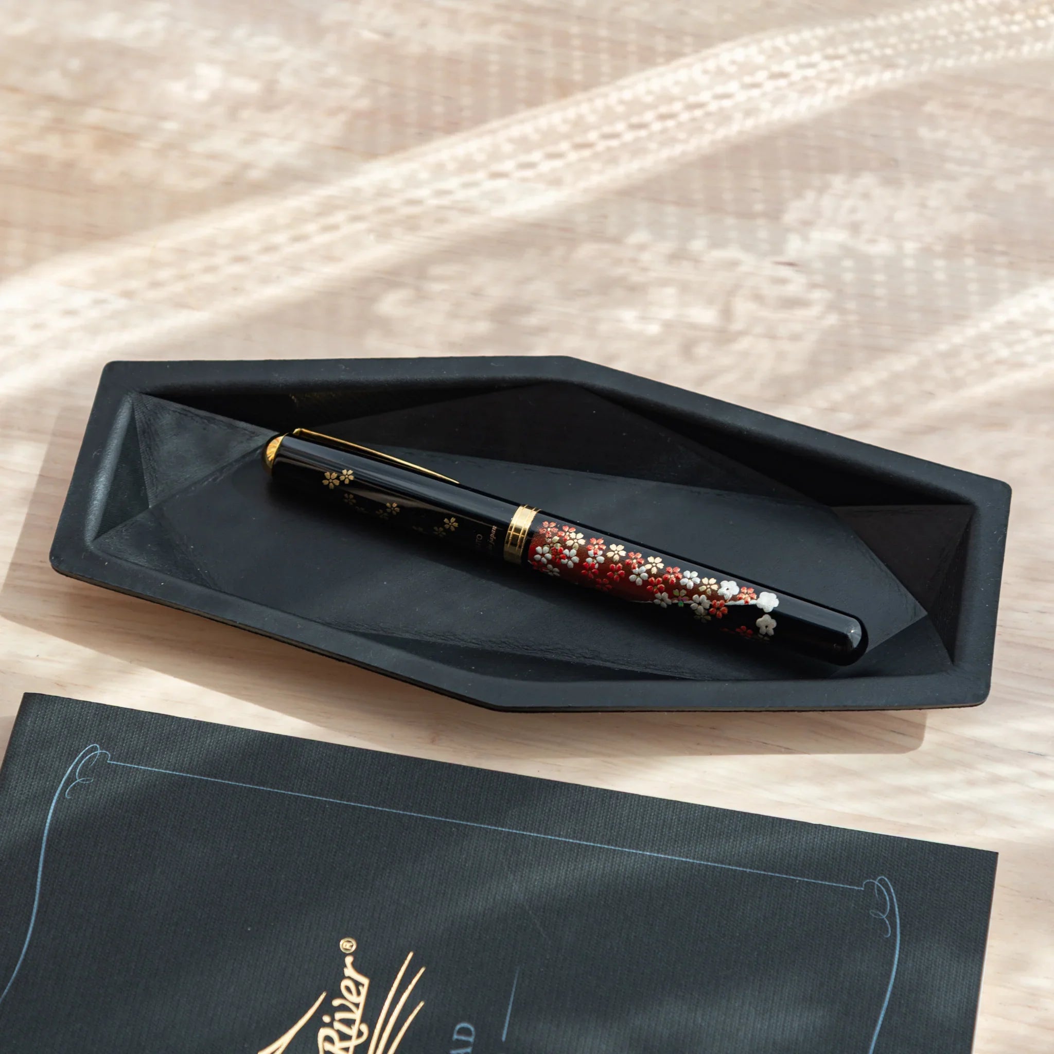 Japanese Pen Tray in black leather with a cherry blossom motif fountain pen.