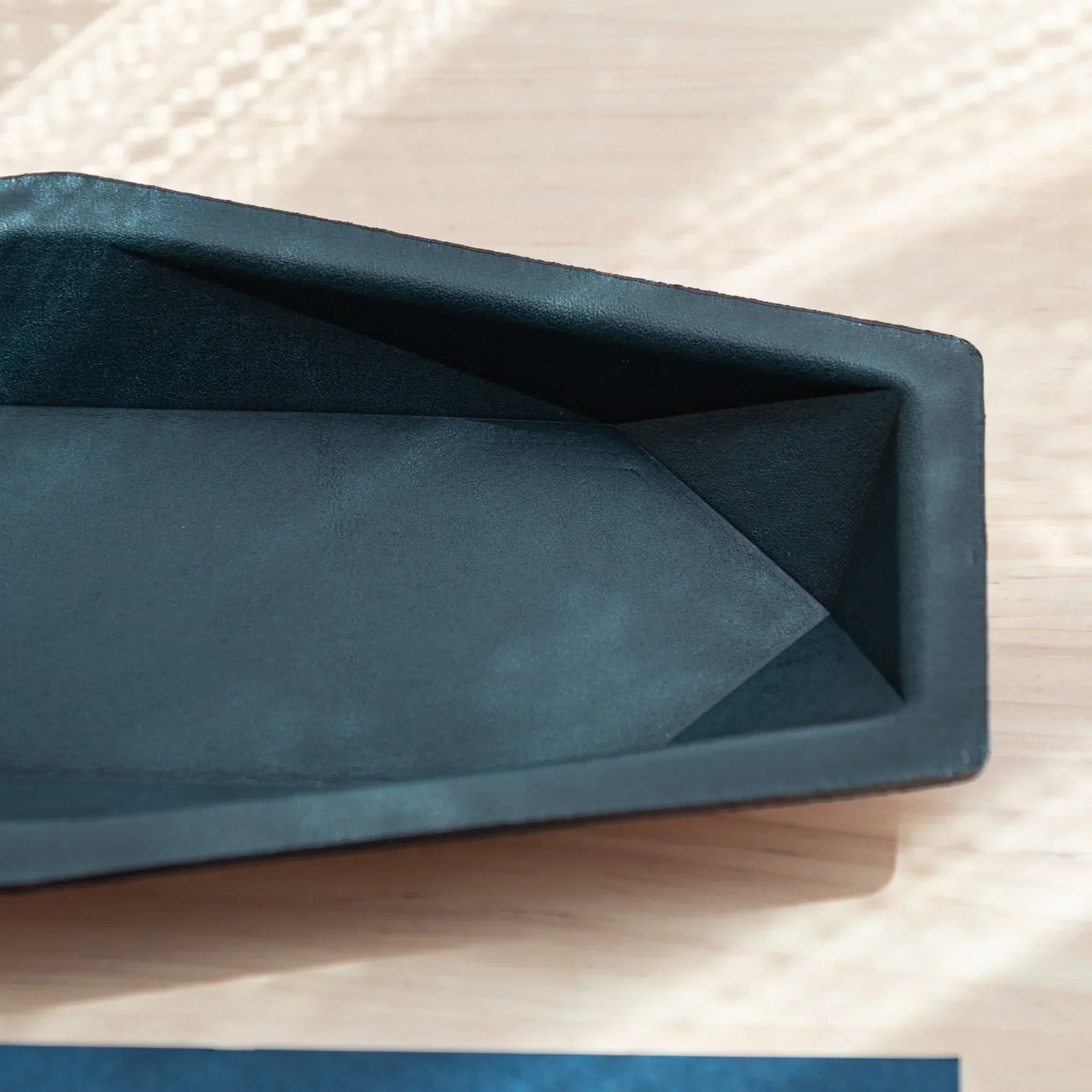 Close-up of the inner Teal-Blue surface of Japanese Pen Tray in geometric slim hex shape.