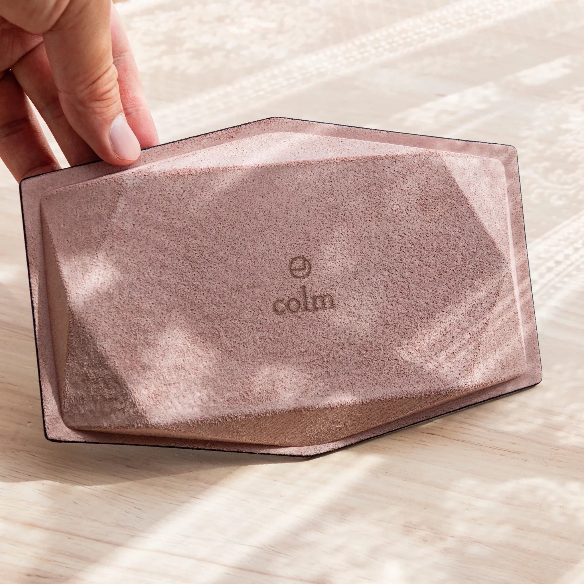 Close-up detail of hexagonal pen tray leather exterior construction and overall finish quality craftsmanship clearly