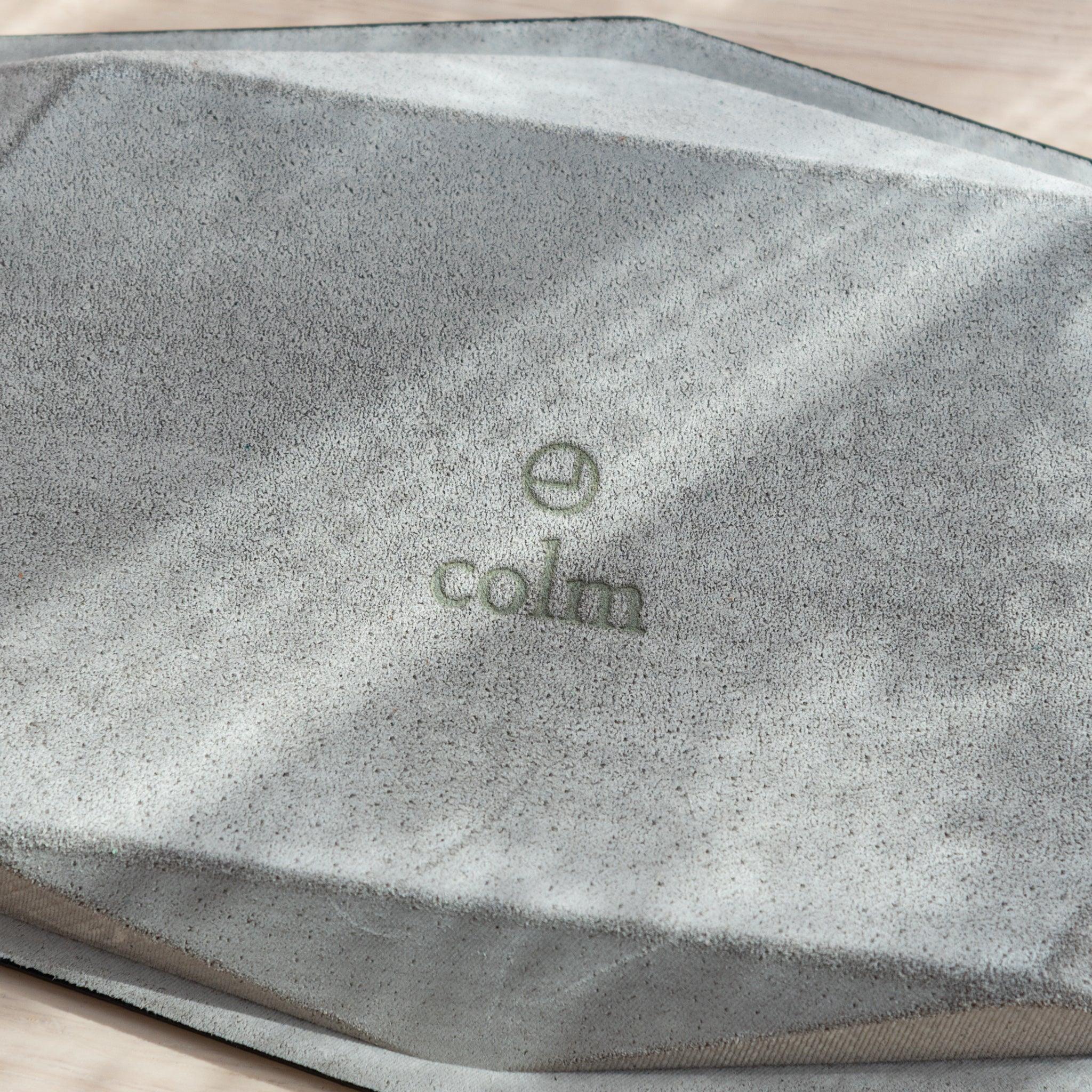 Burgundy hexagonal leather pen tray back view with suede lining material and embossed colm brand identification mark