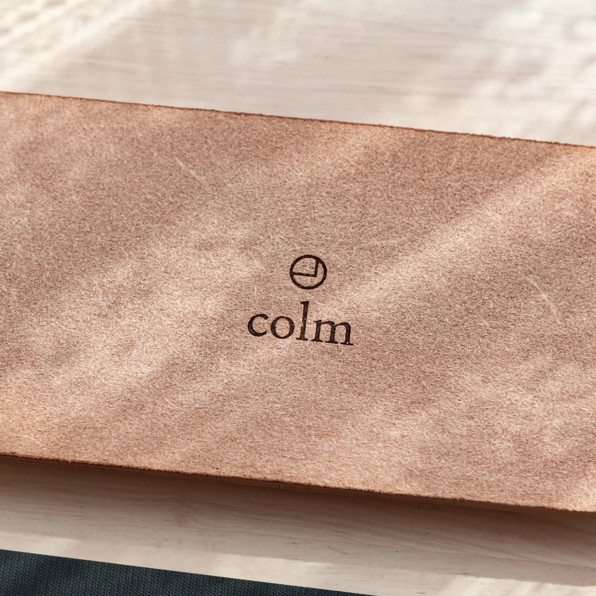 Bottom corner of Japanese pen tray featuring suede texture and anti-slip pads.