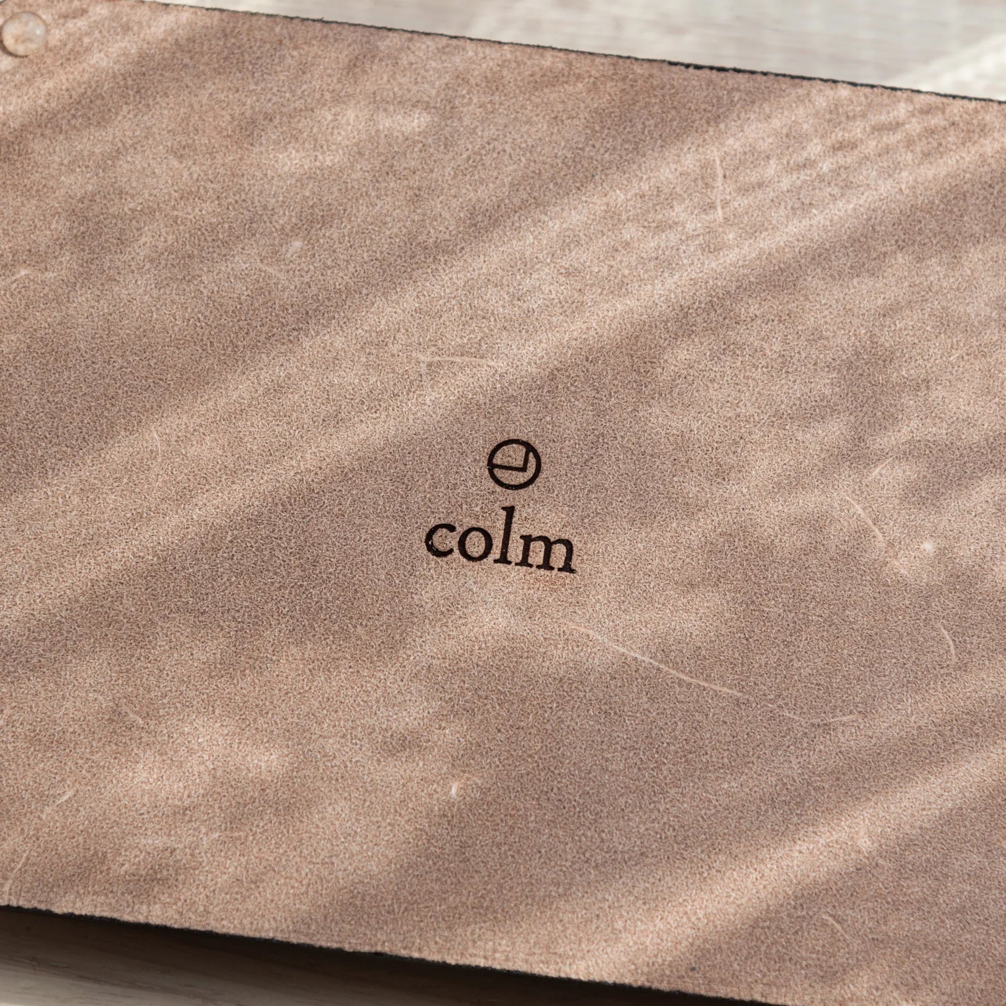 Corner of Japanese Pen Tray showing suede bottom and transparent anti-slip feet.