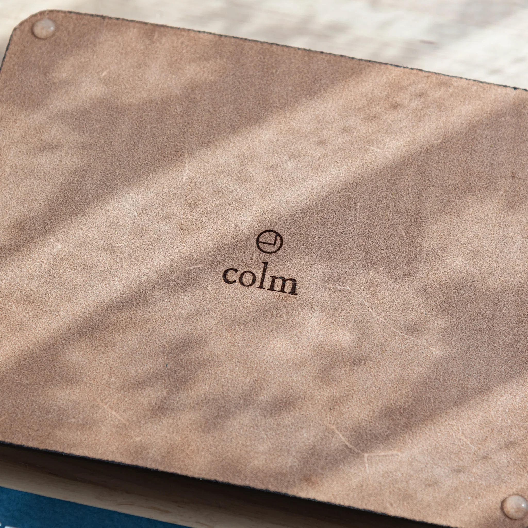 Tan wide leather pen tray at angled perspective showing the rectangular interior design and interior depth proportion