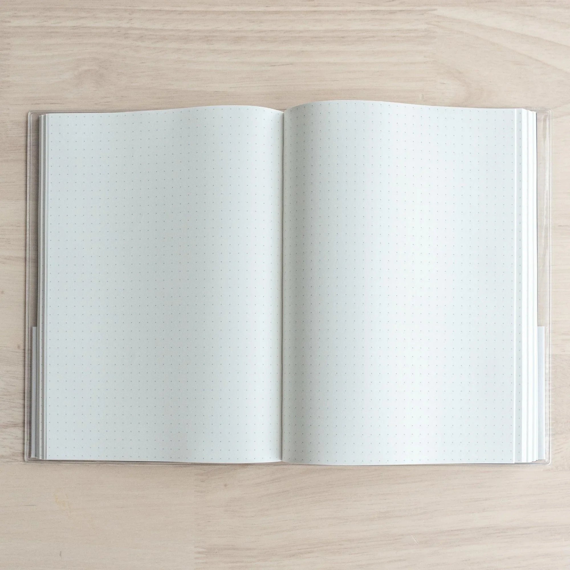 Sanzen A5 hardcover journal with Tomoe River, tilted view of cover and spine detail showing craftsmanship