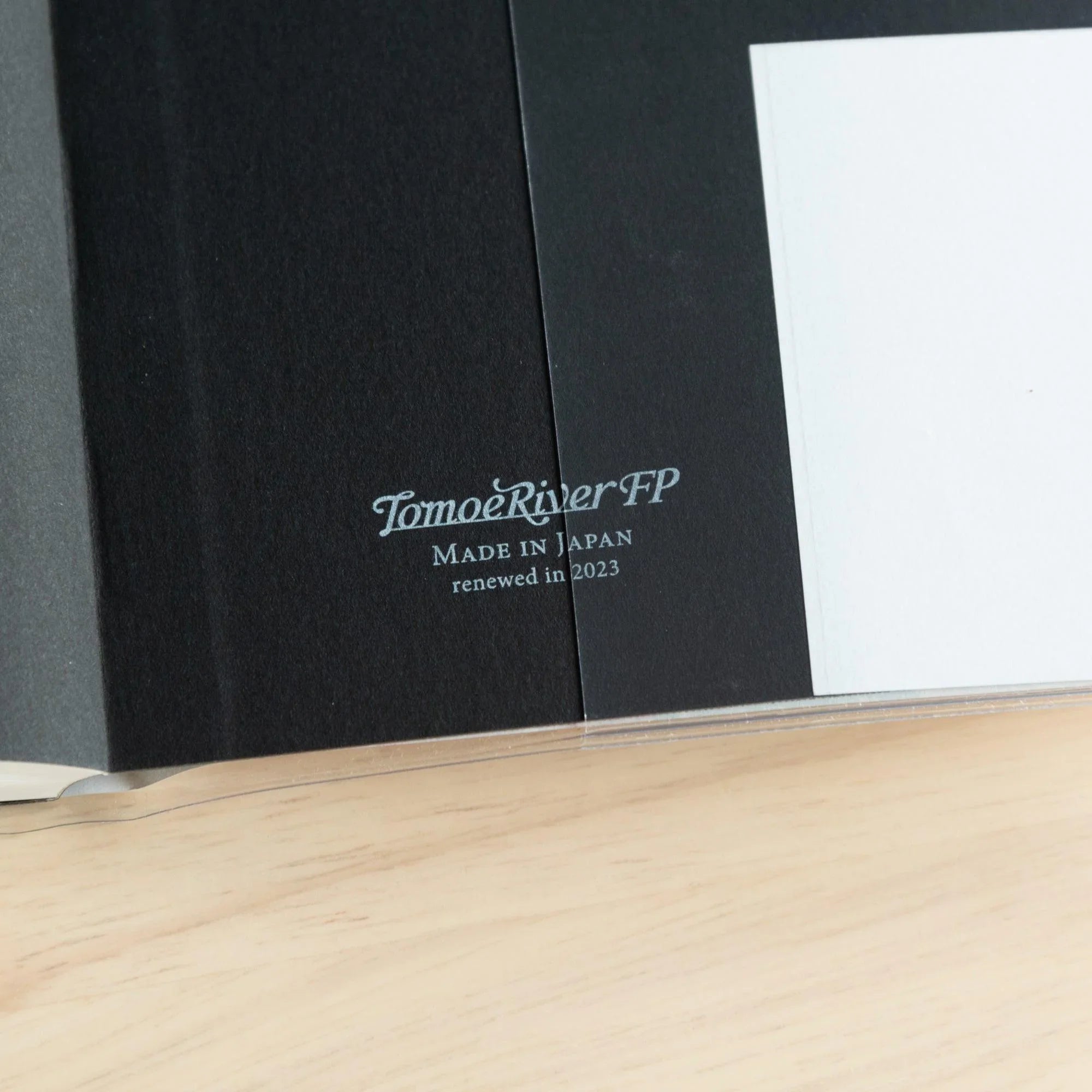 Tomoe River FP A5 368-page hardcover notebook, flat lay of closed journal on neutral white background