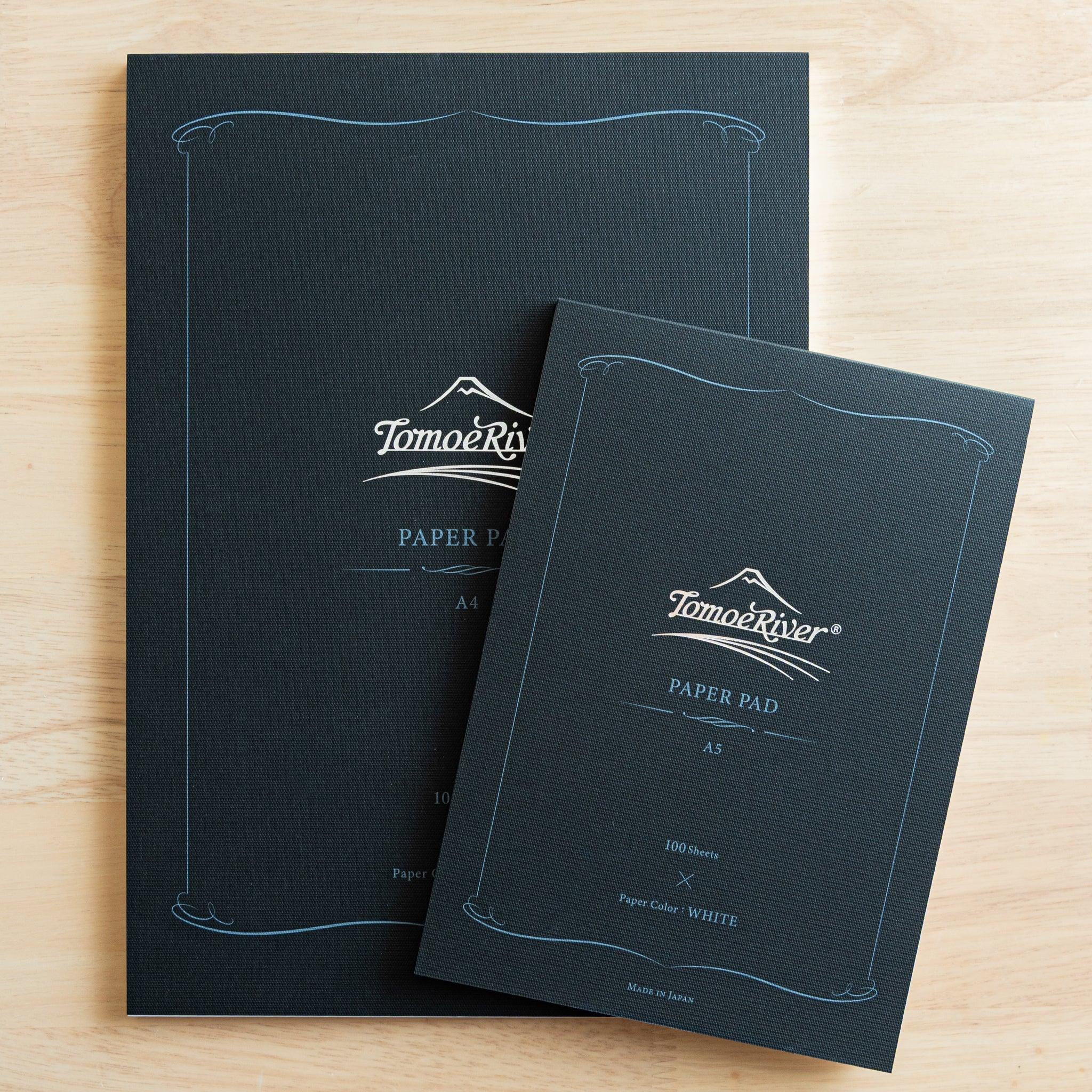 Sanzen Tomoe River FP writing pad with navy textured cover and decorative ornamental border design detail