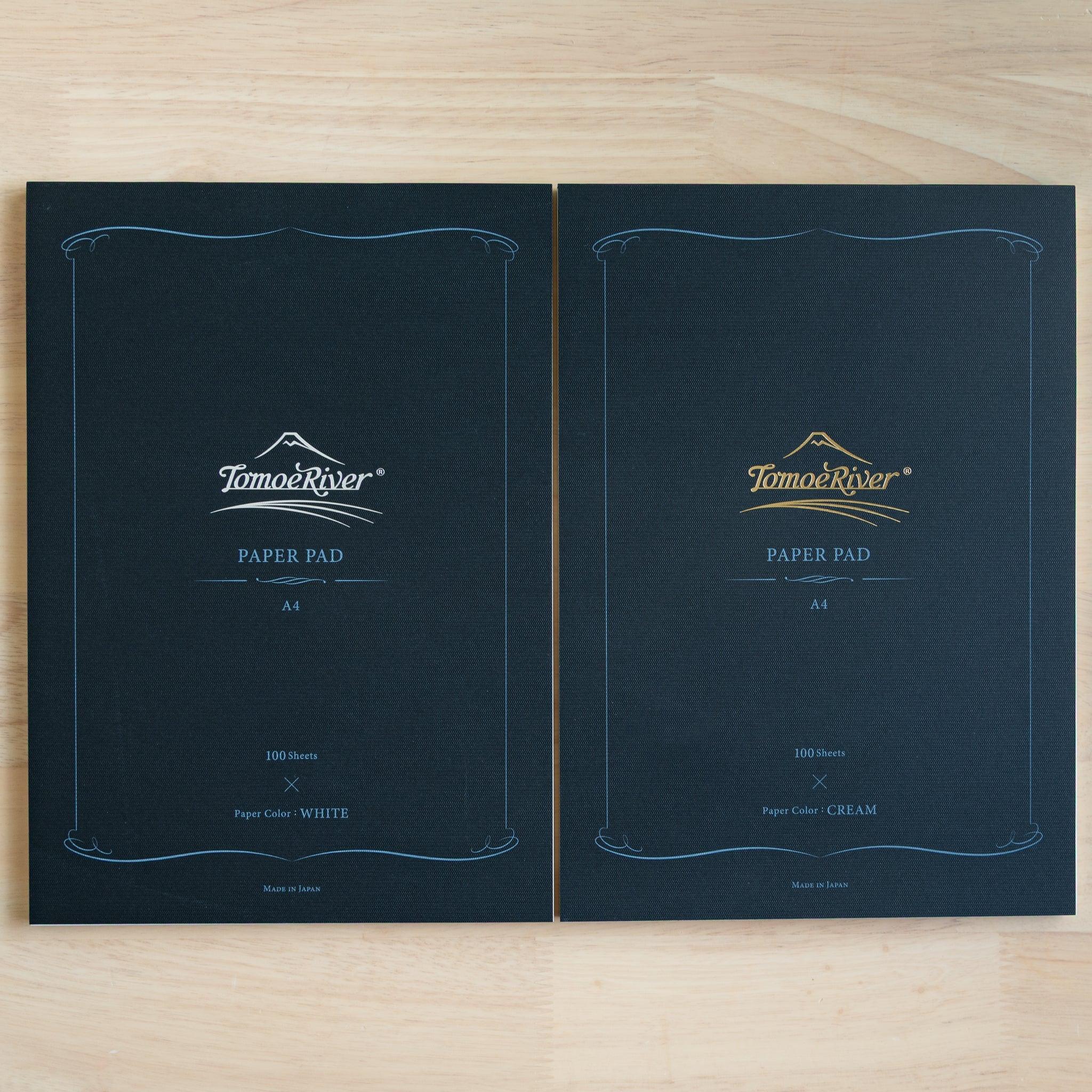 Tomoe River writing pad opened showing fountain pen friendly pages and soft cover construction detail