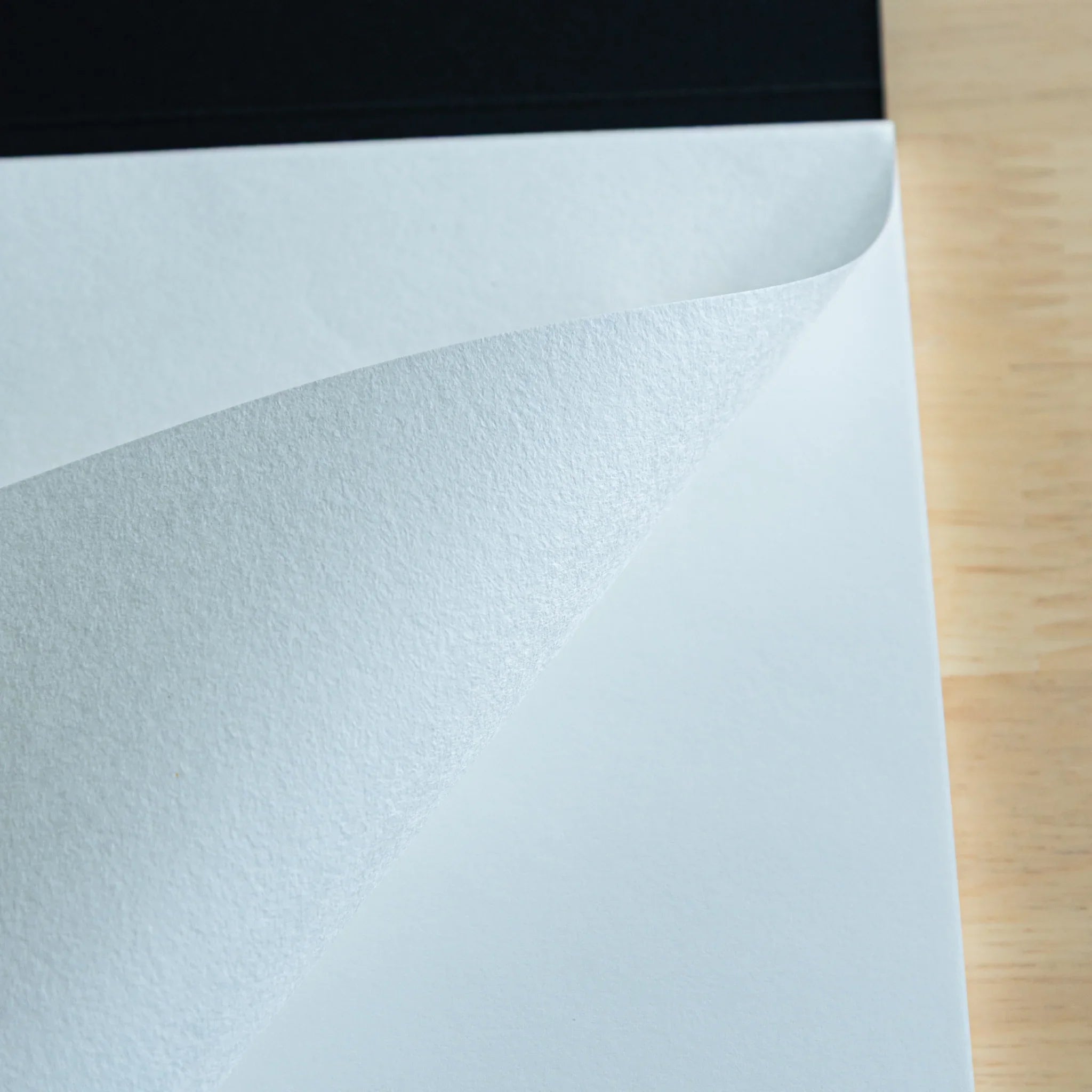 Sanzen Tomoe River FP pad page spread showing blank pages and ruled sections on Japanese paper for fountain pen writing