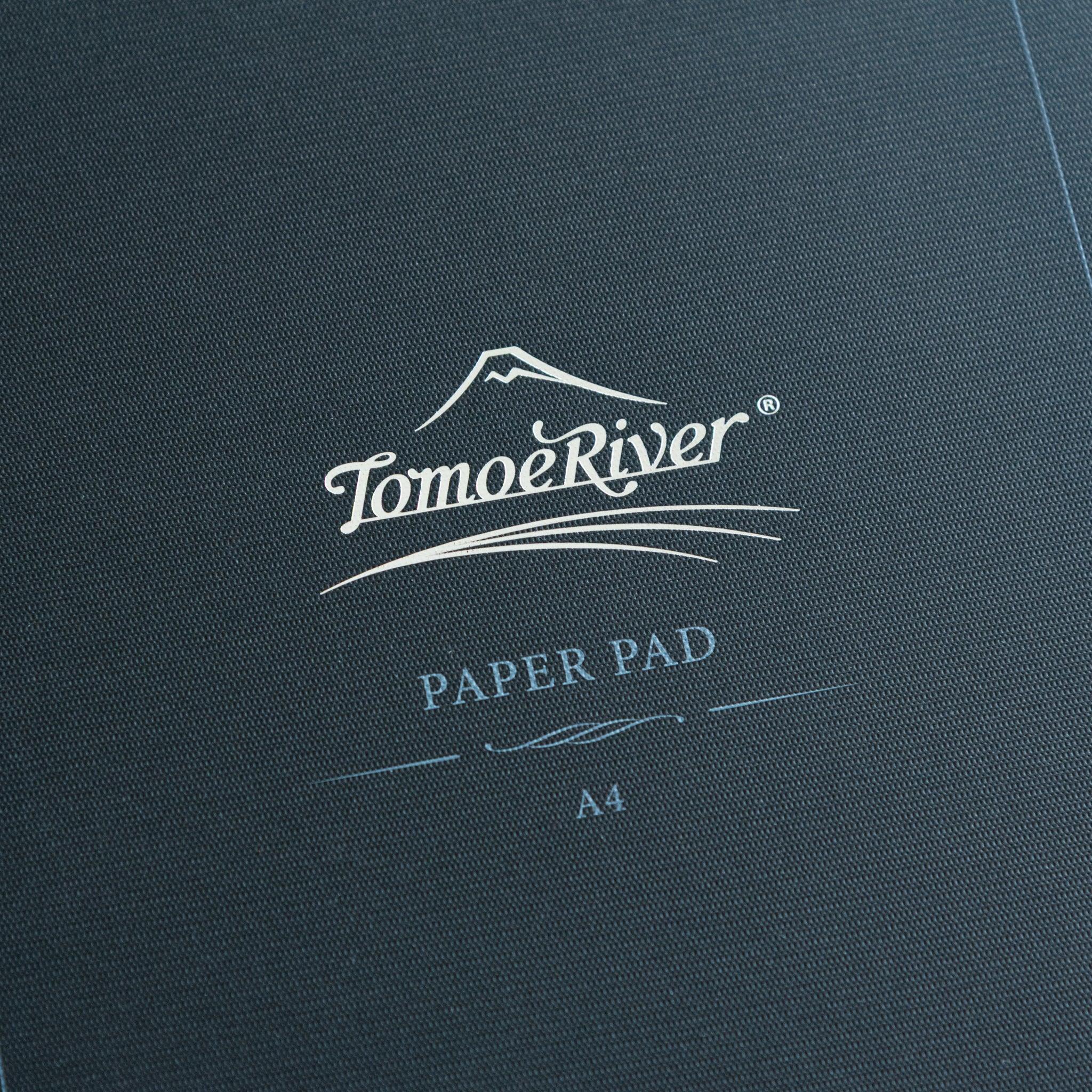 Sanzen Tomoe River writing pad showing navy textured cover and quality interior pages design, Japanese paper