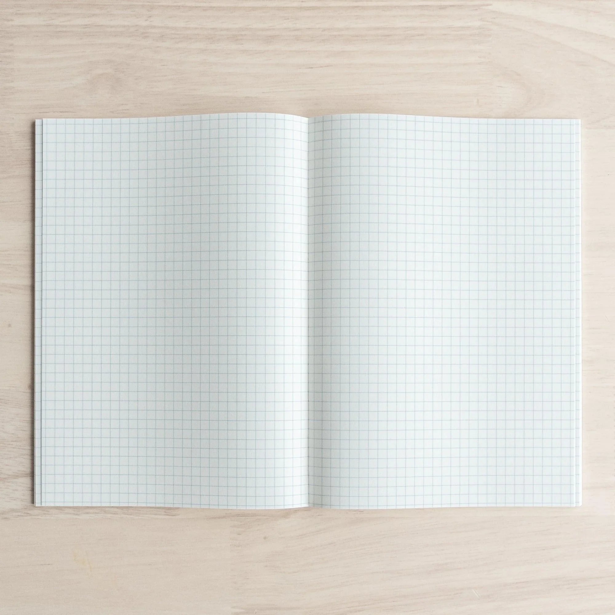 Tomoe River A5 soft cover 160-page, pages spread flat showing quality paper edge quality and binding durability