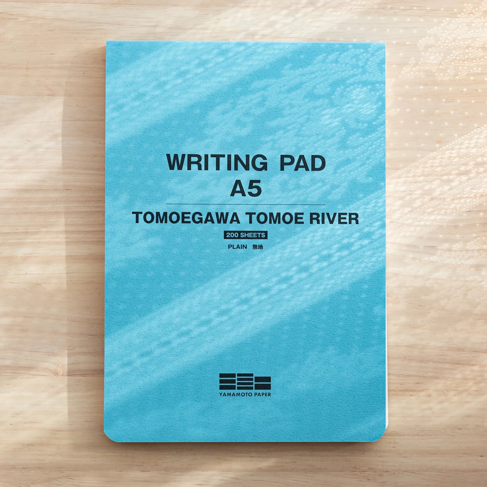 A5 writing pad with Tomoe River paper cover featuring decorative design element detail clearly visible