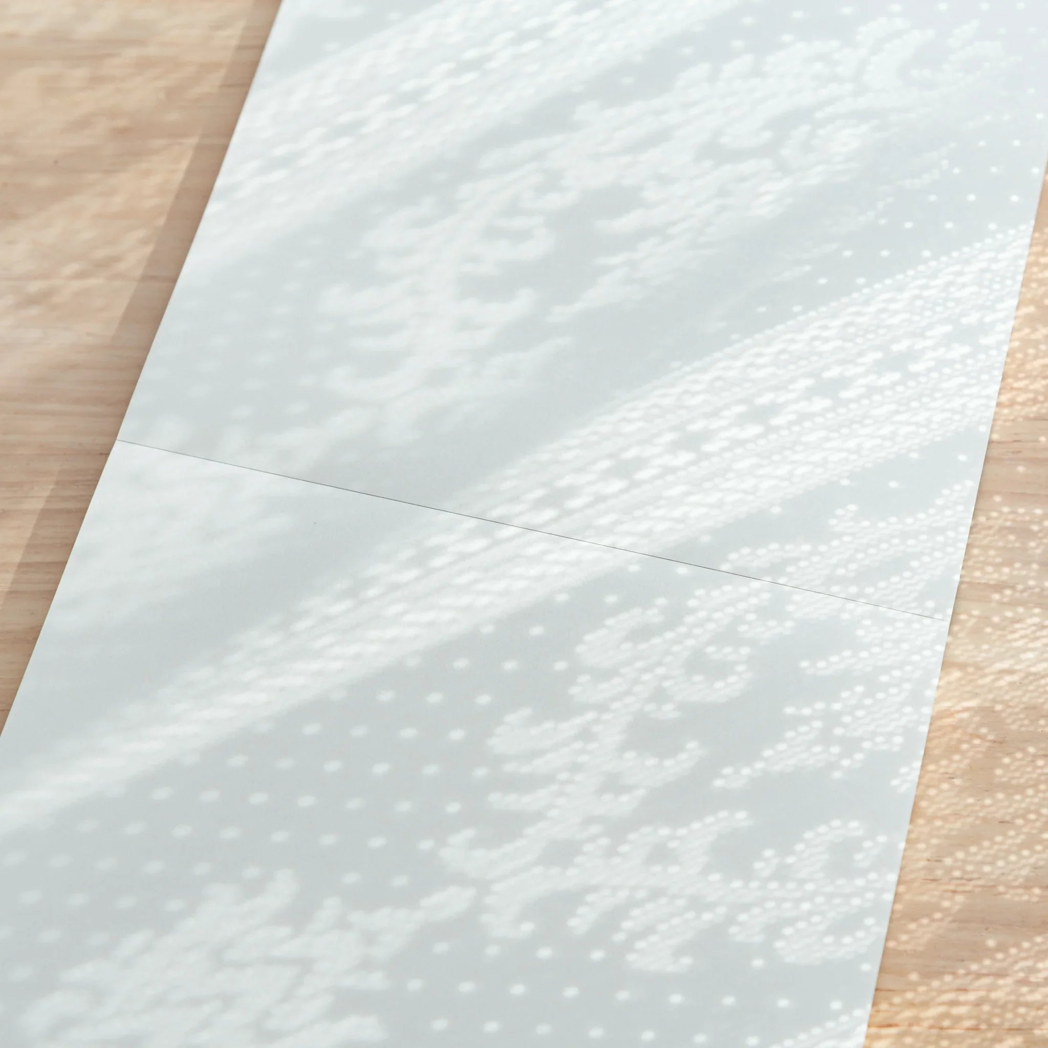 Pad cover with decorative motif illustration and brand identification text information clearly displayed