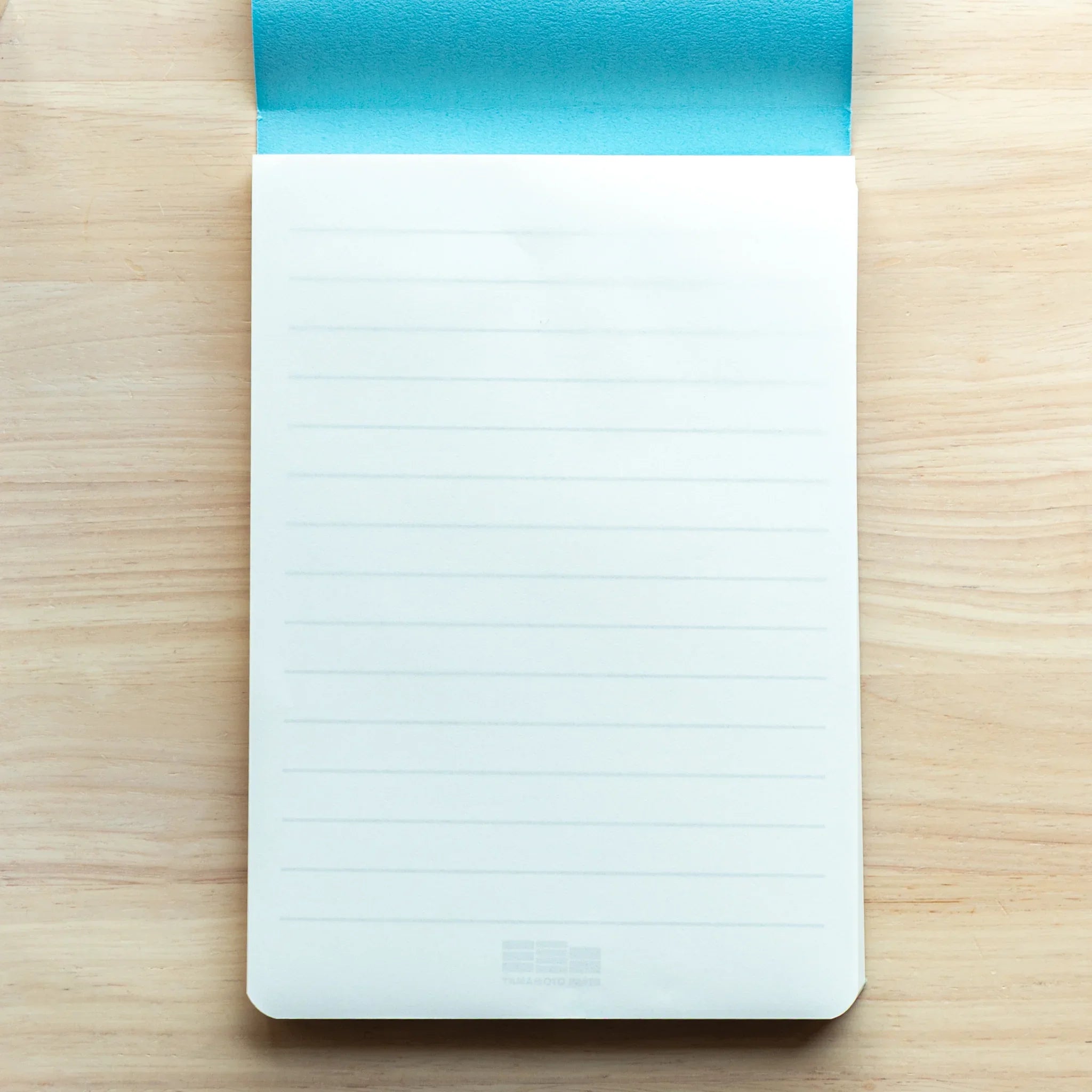 Writing pad interior showing Tomoe River paper pages with smooth fine texture detail clearly visible