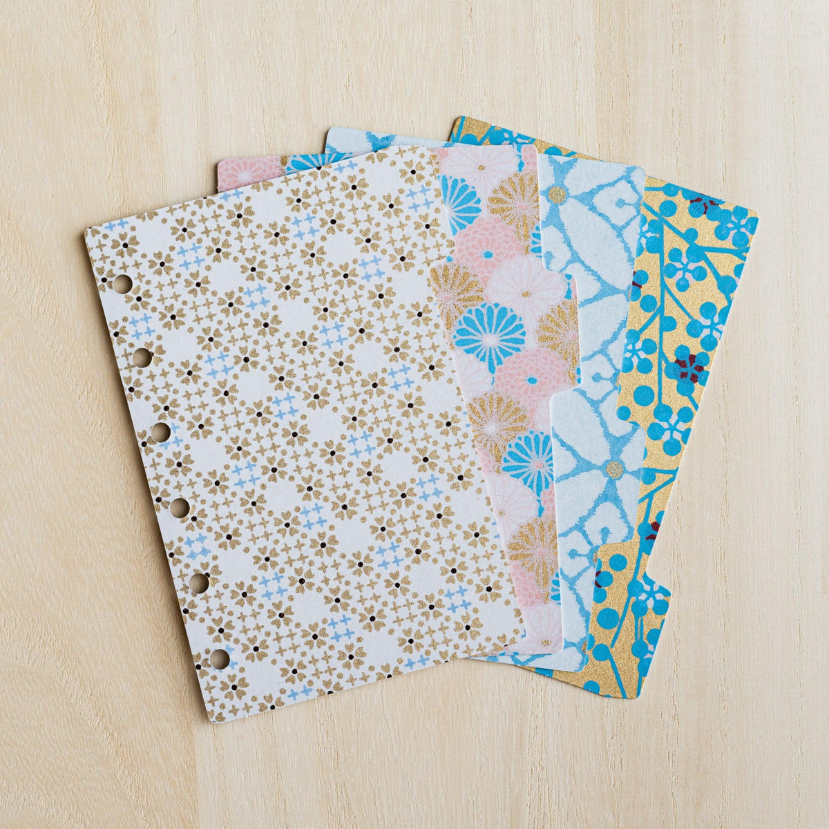 Four Tone Yuzen washi index dividers for Mini 6 planners fanned out, gold, pink and blue floral prints