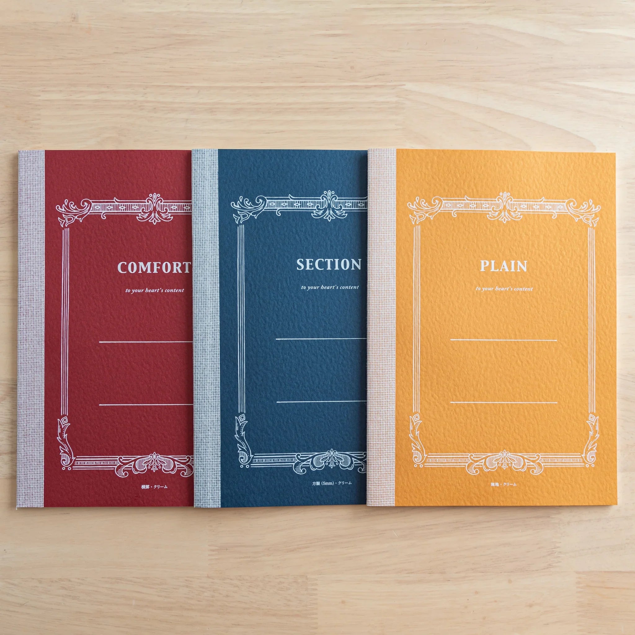 Tsubame Fools Cream Notebook flat lay with cover face up, natural light highlighting paper texture and finish