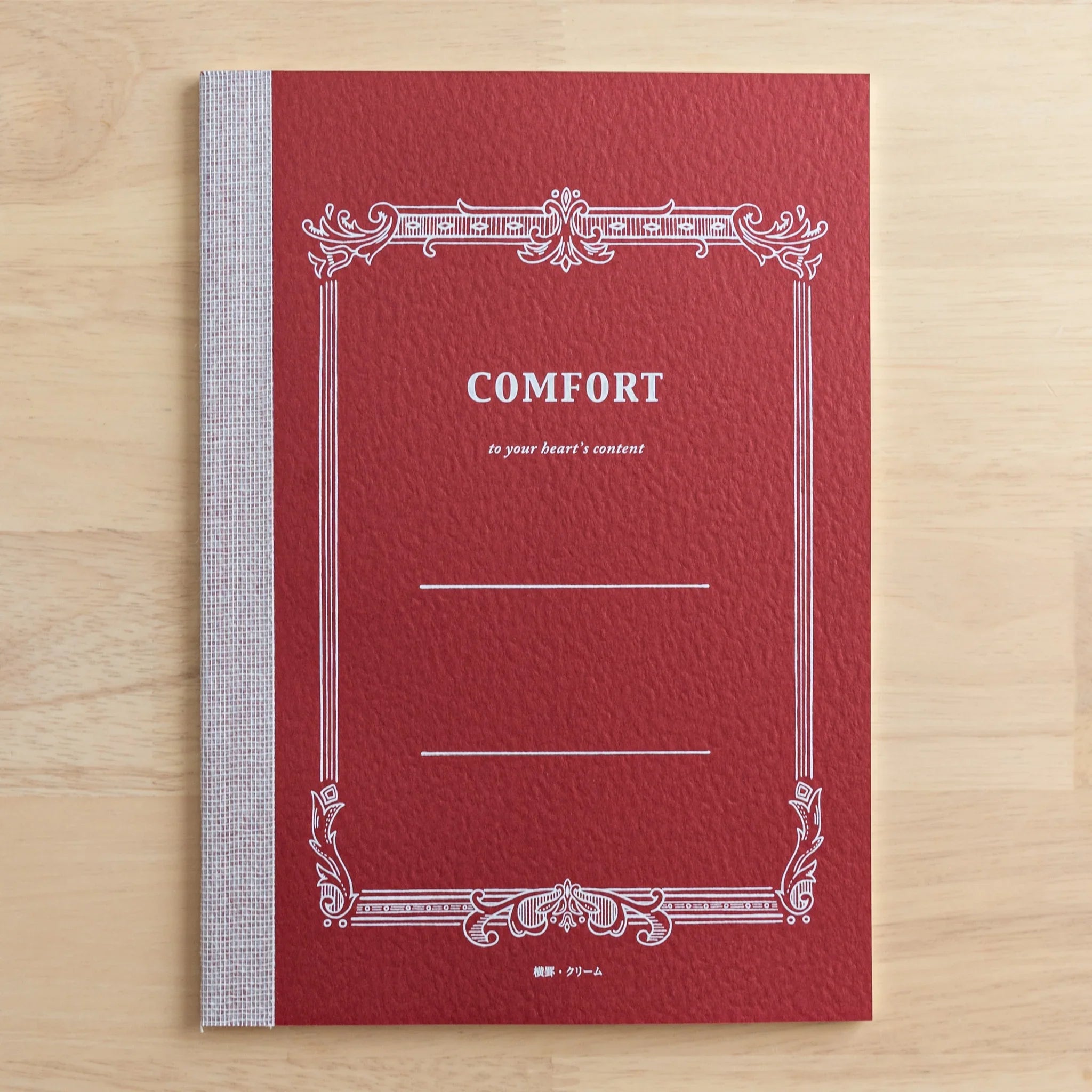 Tsubame Fools Cream Notebook at angle showing open page spread alongside cover composition and detail