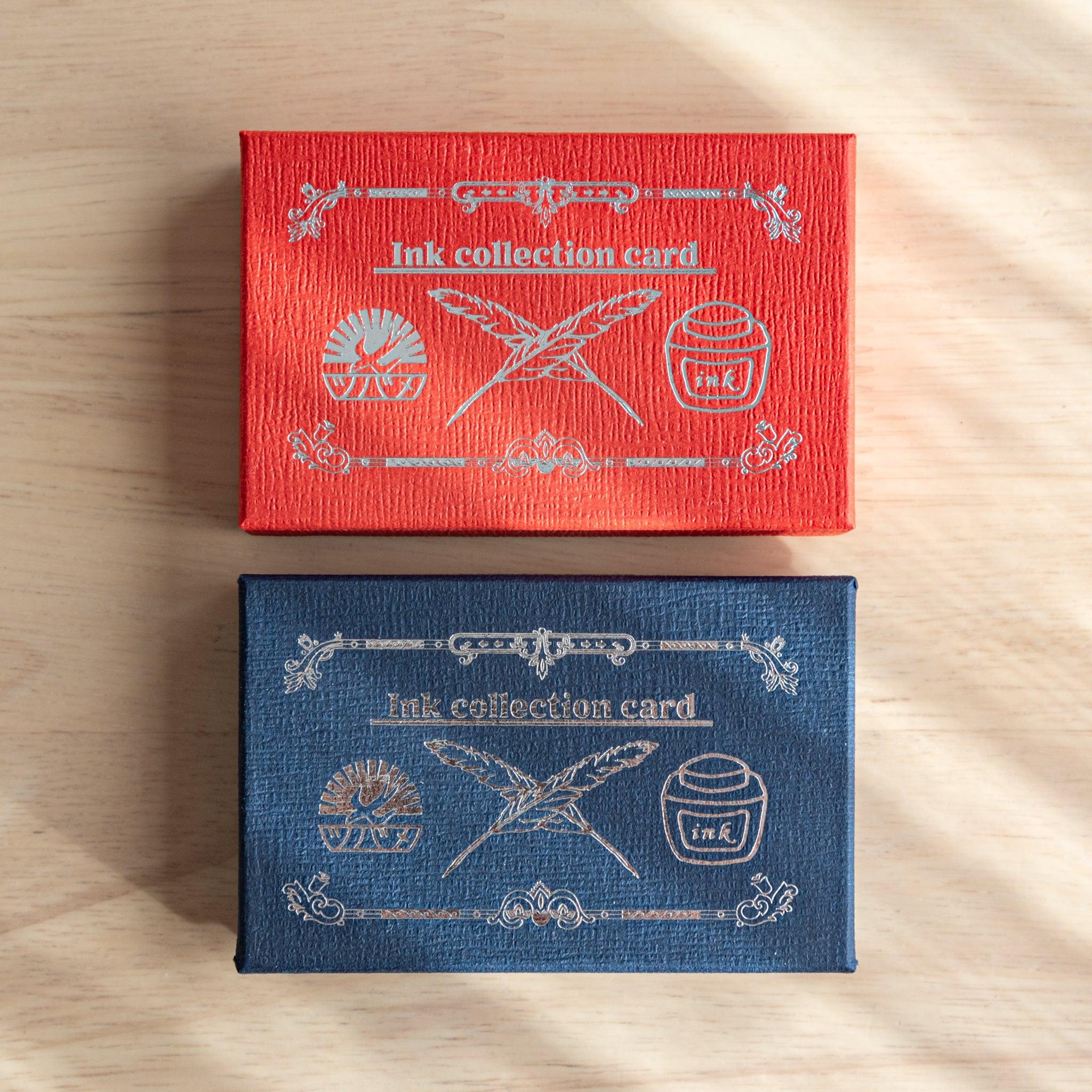 Two Tsubame Japanese stationery boxes, one red and one navy, with silver embossed designs featuring quills, ink bottles, and the brand logo, labeled "Ink collection card."
