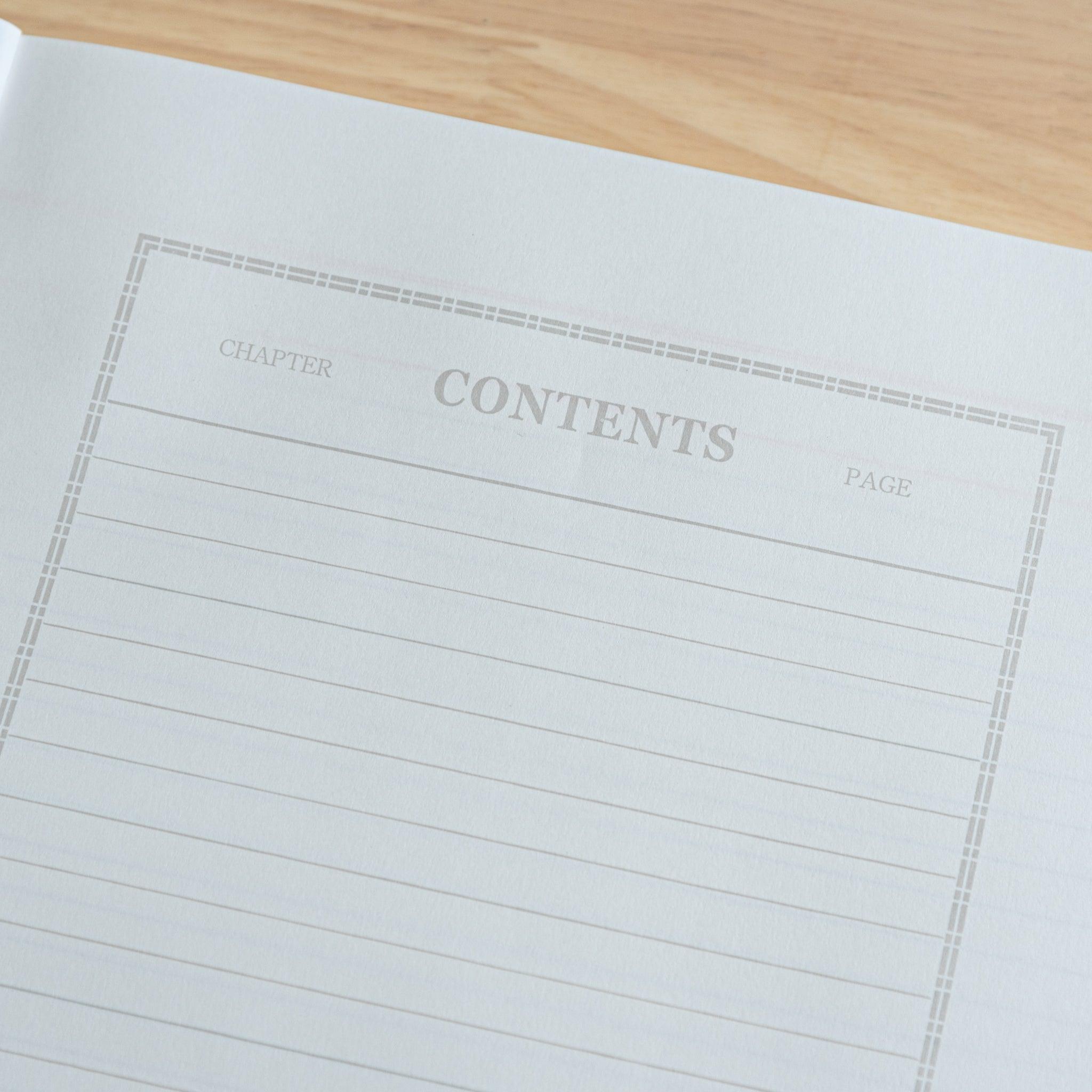 An open Japanese notebook featuring a structured contents page with lined sections for chapters and page numbers, highlighting premium Japanese stationery.