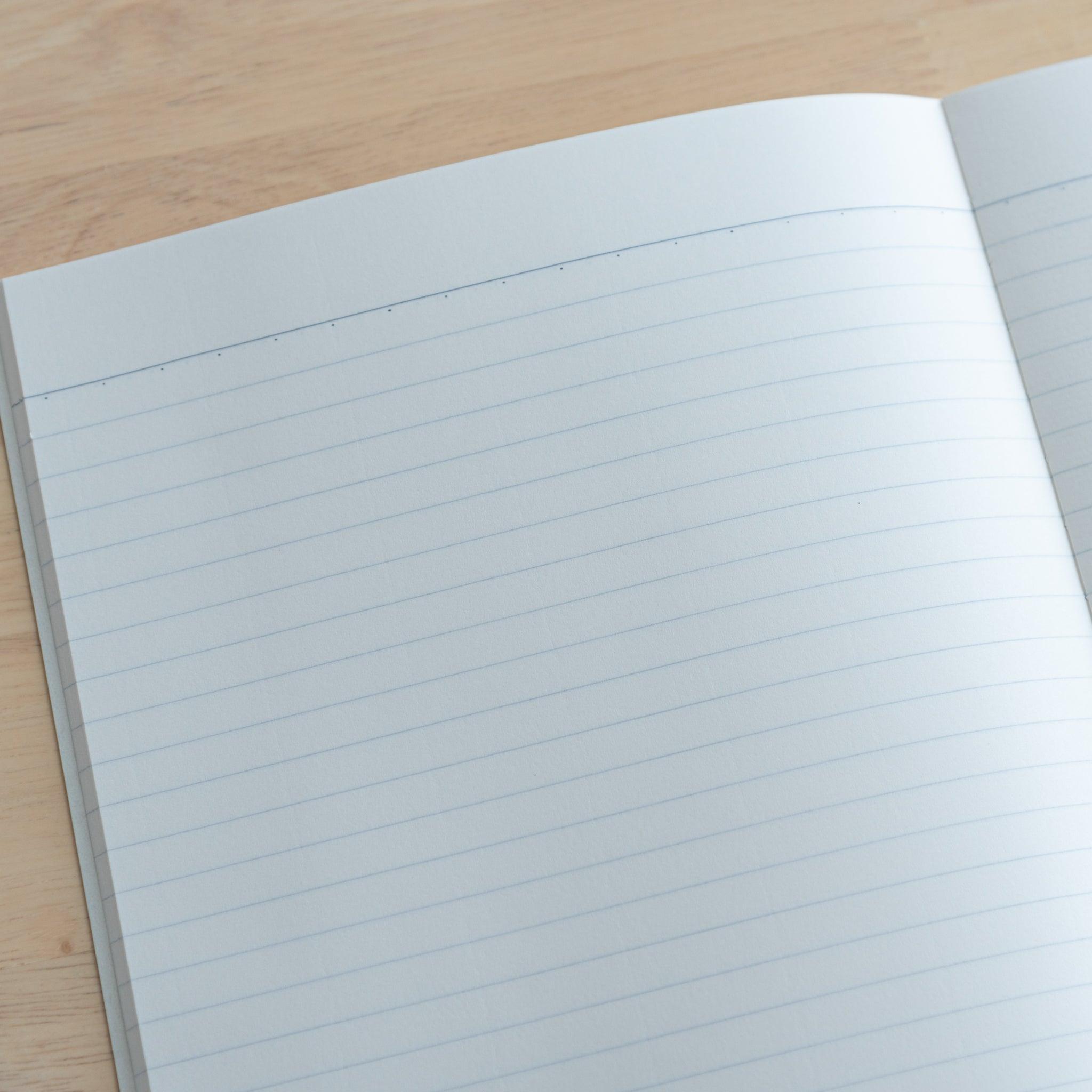 A close-up of a Tsubame Japanese notebook’s lined pages, highlighting the smooth, acid-free paper and precise ruling, ideal for high-quality Japanese stationery.