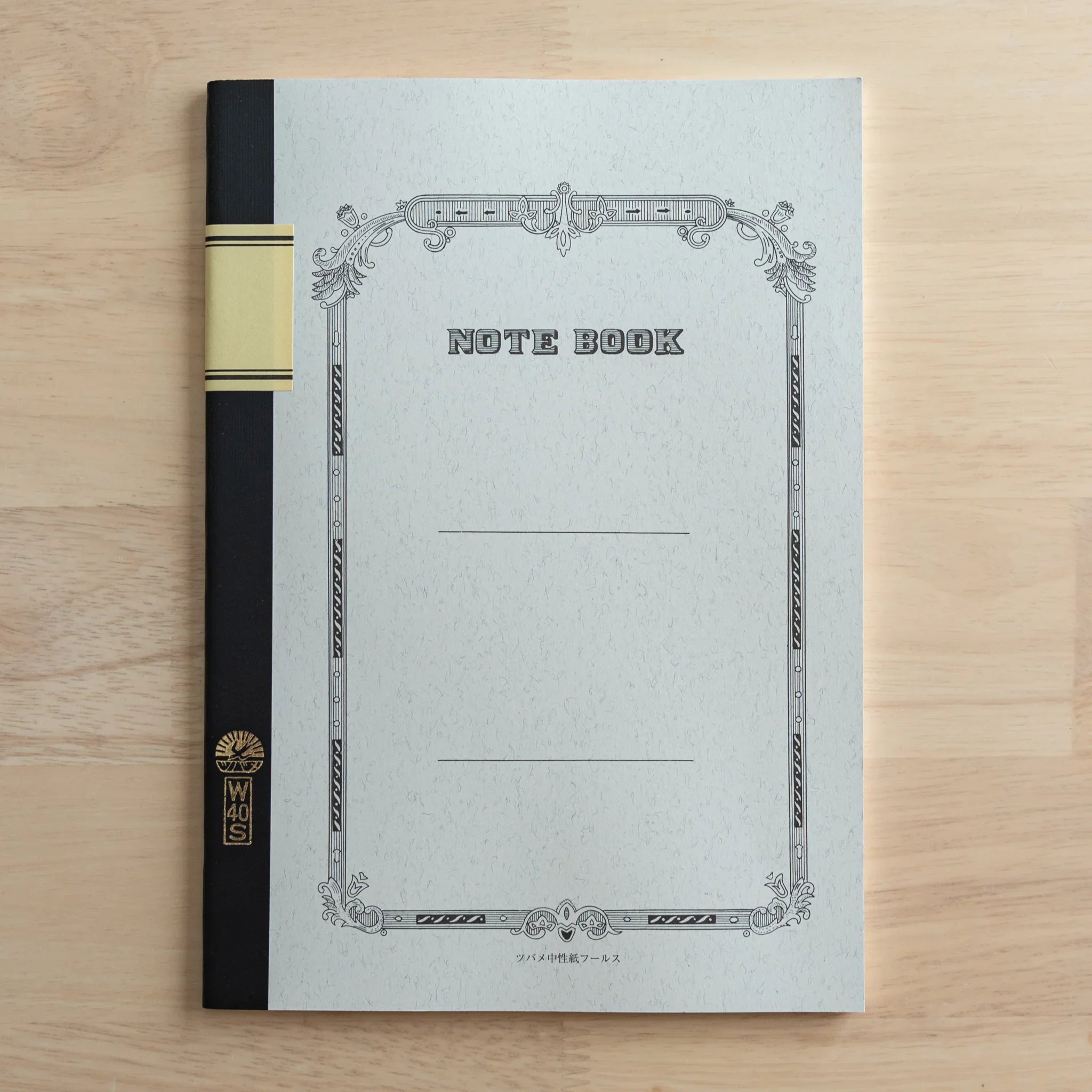 Open notebook showing blank cream pages paired with ruled sections for flexible note-taking applications