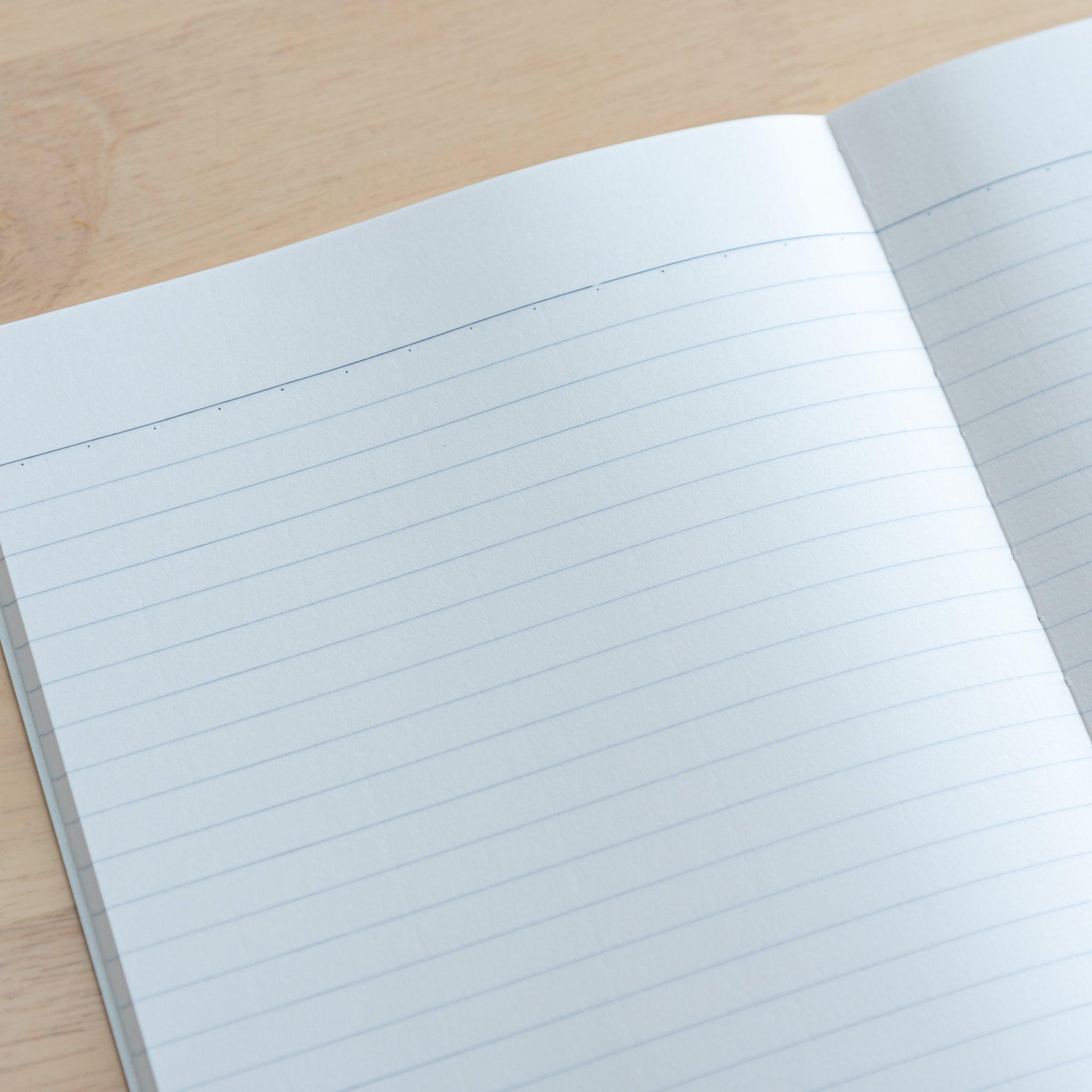 A close-up of a Tsubame Japanese notebook’s lined pages, highlighting the smooth, acid-free paper and precise ruling, ideal for high-quality Japanese stationery.
