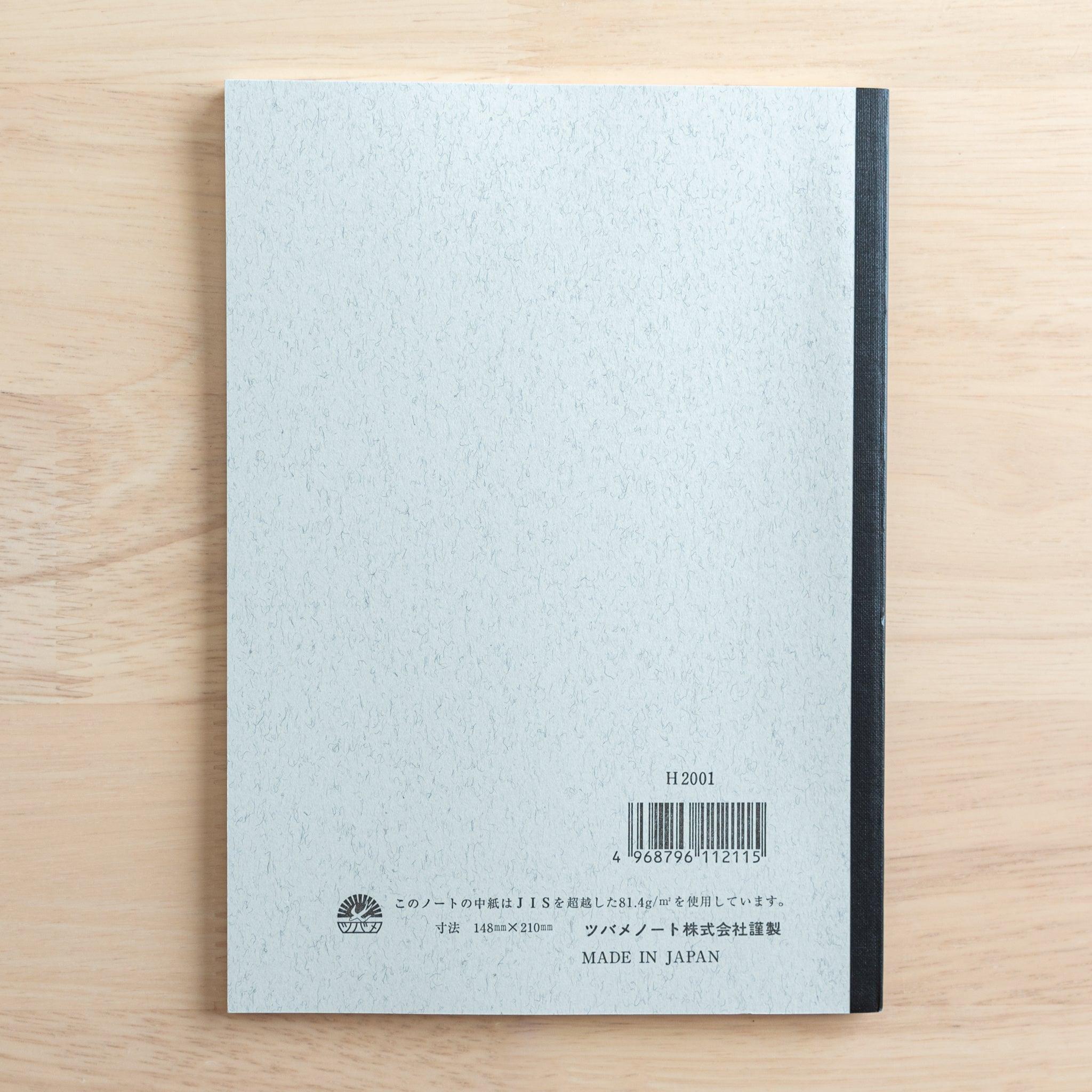 The back cover of a Tsubame Japanese notebook with a black spine, featuring product details, a barcode, and "Made in Japan" text, representing fine Japanese stationery.