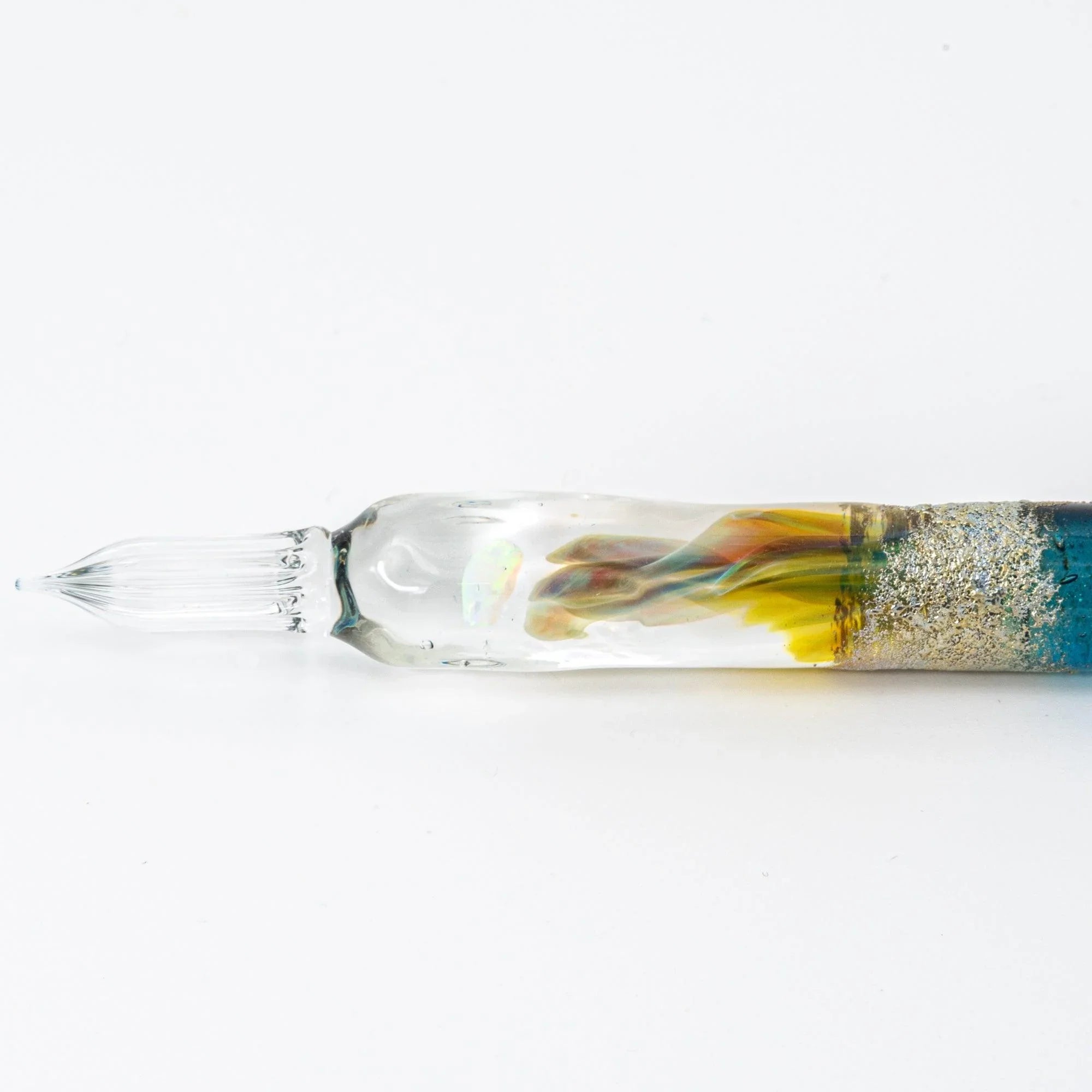 Deep blue glass dip pen with rich translucent color tone and artistic twisted nib design element throughout shine