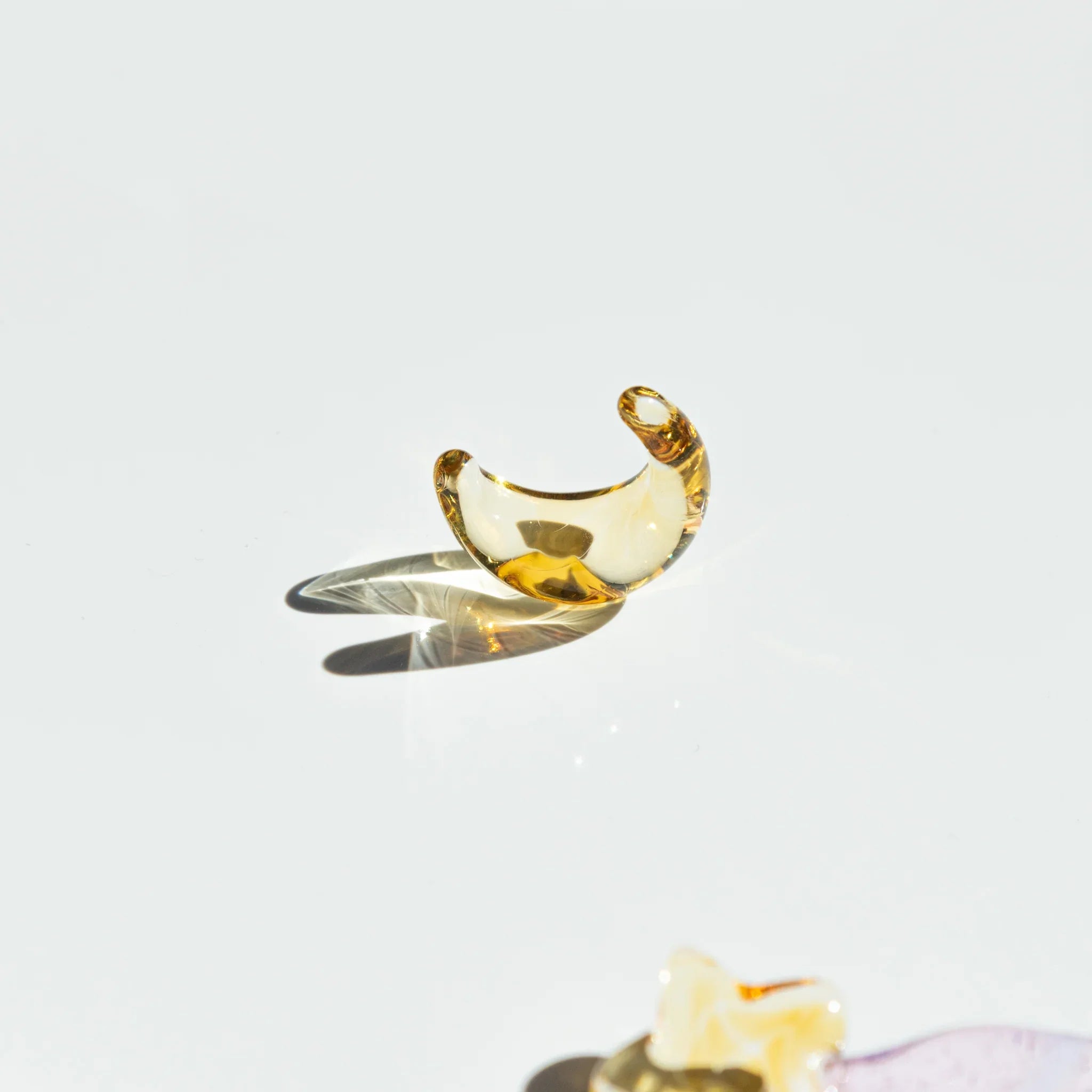 Purple and white Twilight Star glass dip pen with multiple gold star-shaped pen rests on neutral white background