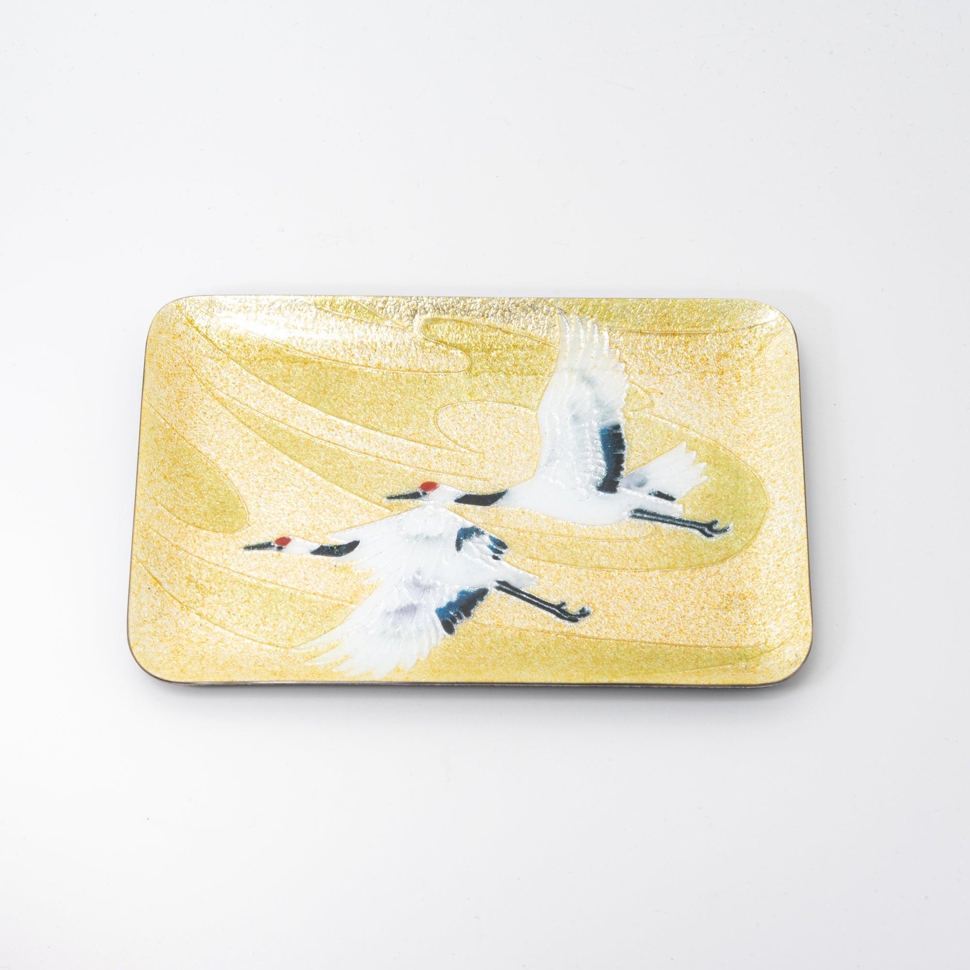 A rectangular tray adorned with a crane motif and golden waves, showcasing intricate Japanese craftsmanship and aesthetic.