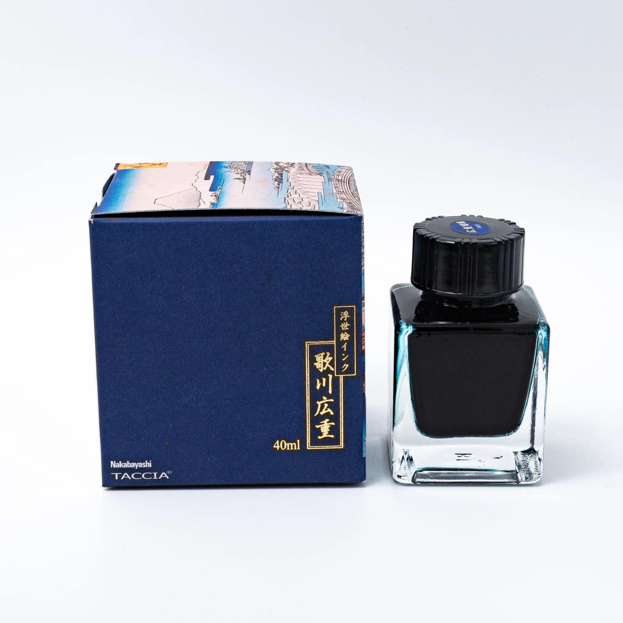 Hiroshige Ruri decorative box and deep blue lapis lazuli ink bottle displayed at side angle on white background