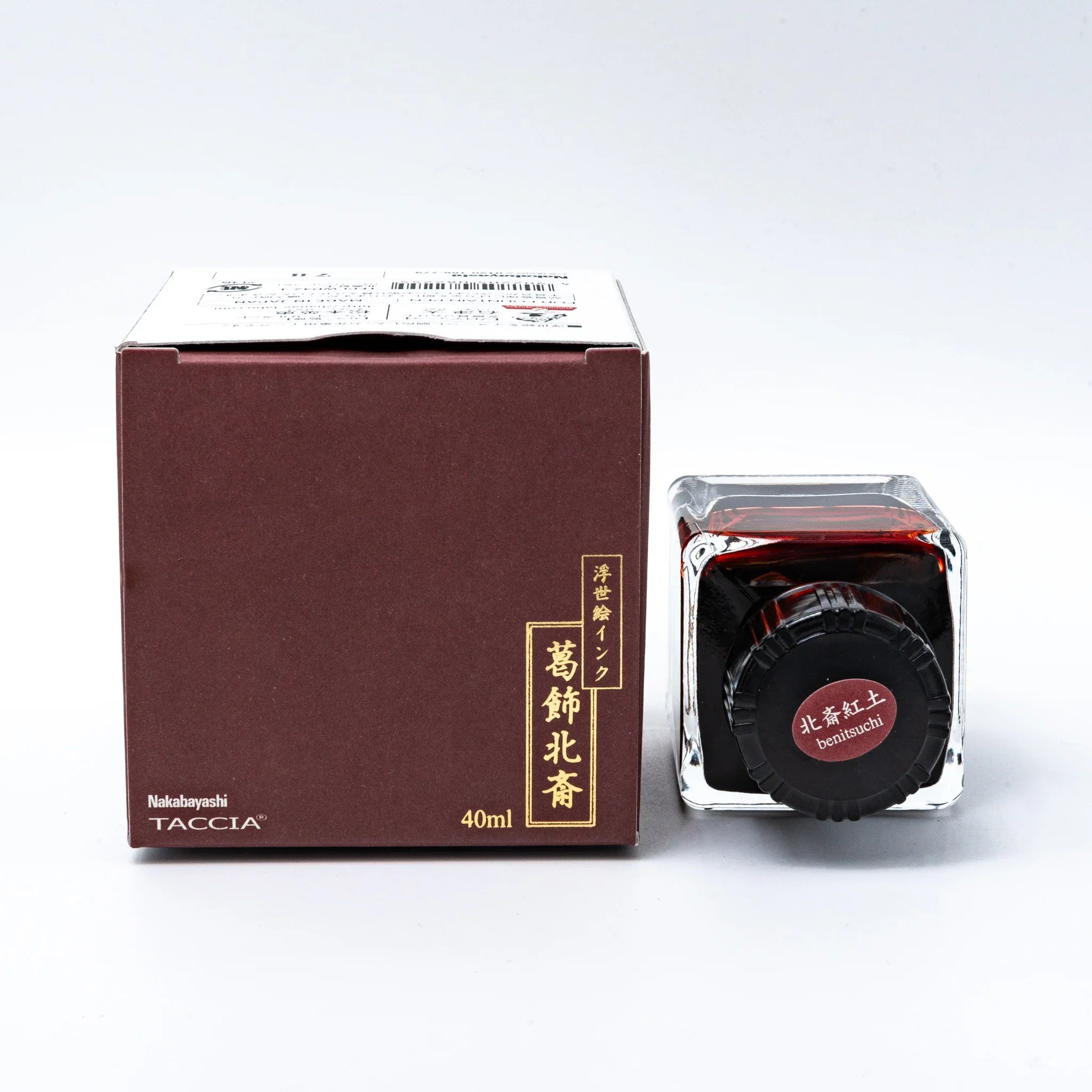 TACCIA Hokusai-benitsuchi fountain pen ink showing deep rust red color and complete presentation, bottle front view with