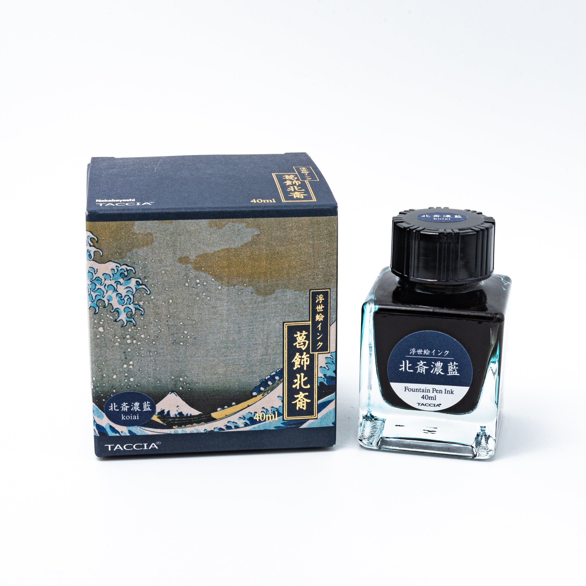 Japanese stationery fountain pen ink. The packaging features Ukiyo-e art of a great wave with Mount Fuji. The glass bottle contains 40ml of deep blue "Koiai" ink.
