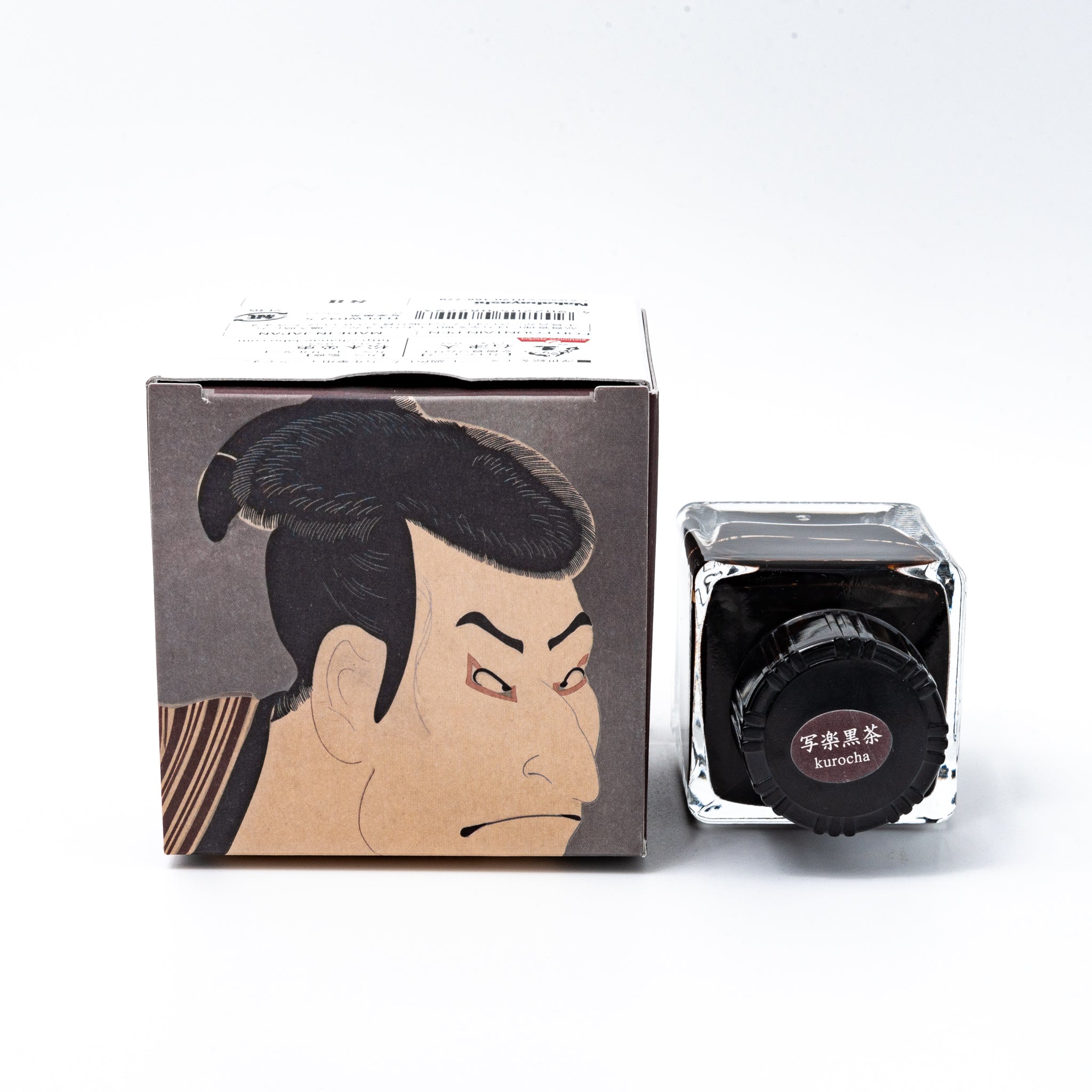 Japanese stationery fountain pen ink. The packaging features Ukiyo-e style art of a kabuki actor in a dark brown kimono. The glass bottle contains 40ml of brown "Kurocha" ink.