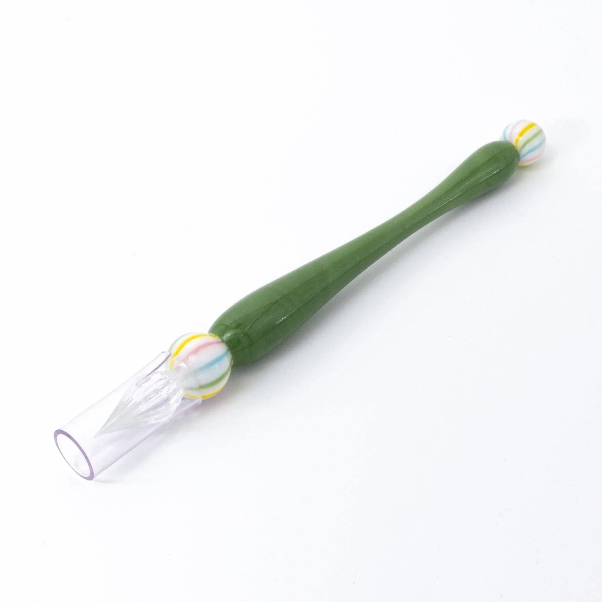 Matcha dip pen showing pale sage green glass handle and ornamental glass bead composition on light backdrop