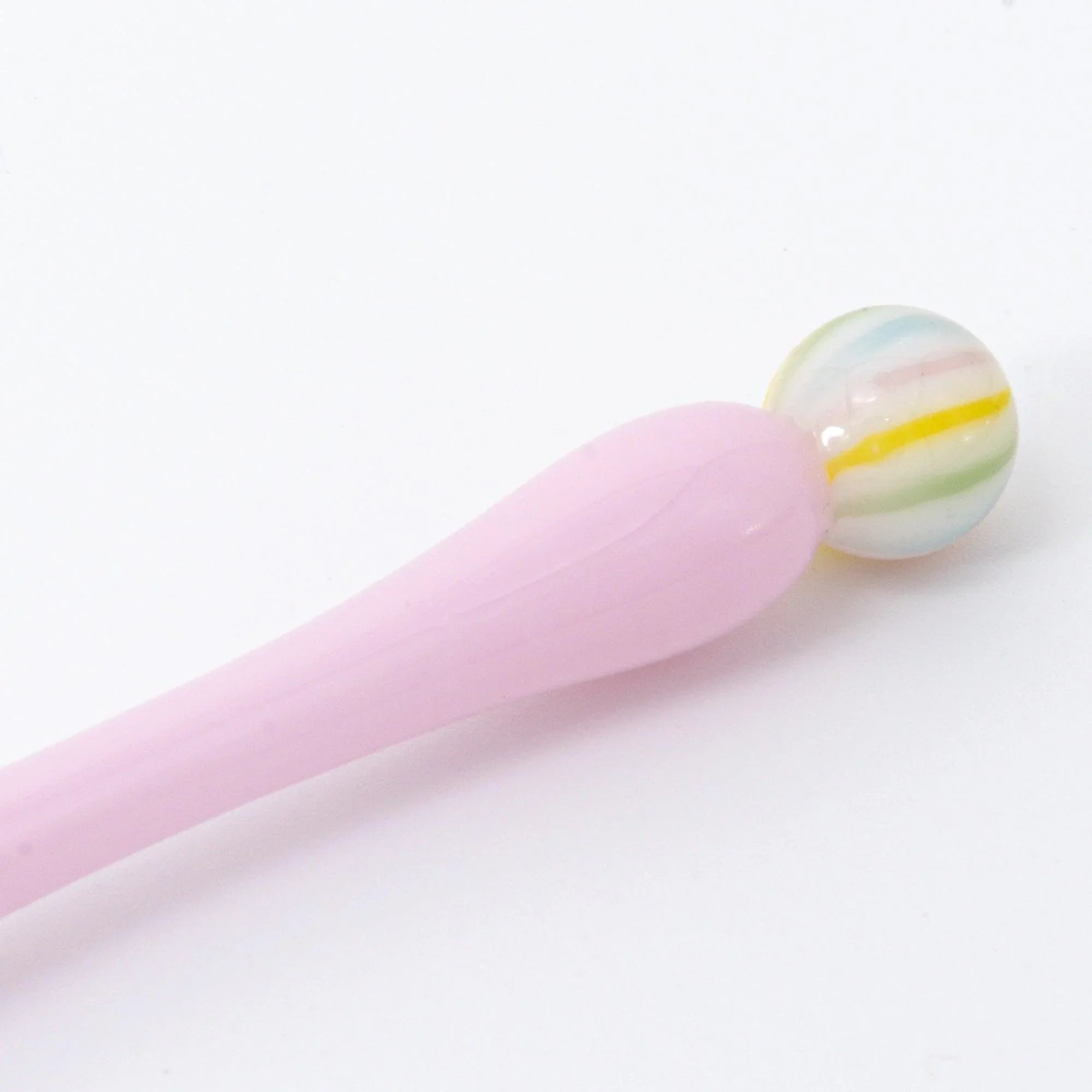 Pale pink Wagashi Sakura Mochi glass dip pen with gradient handle shown at slight angle on light background