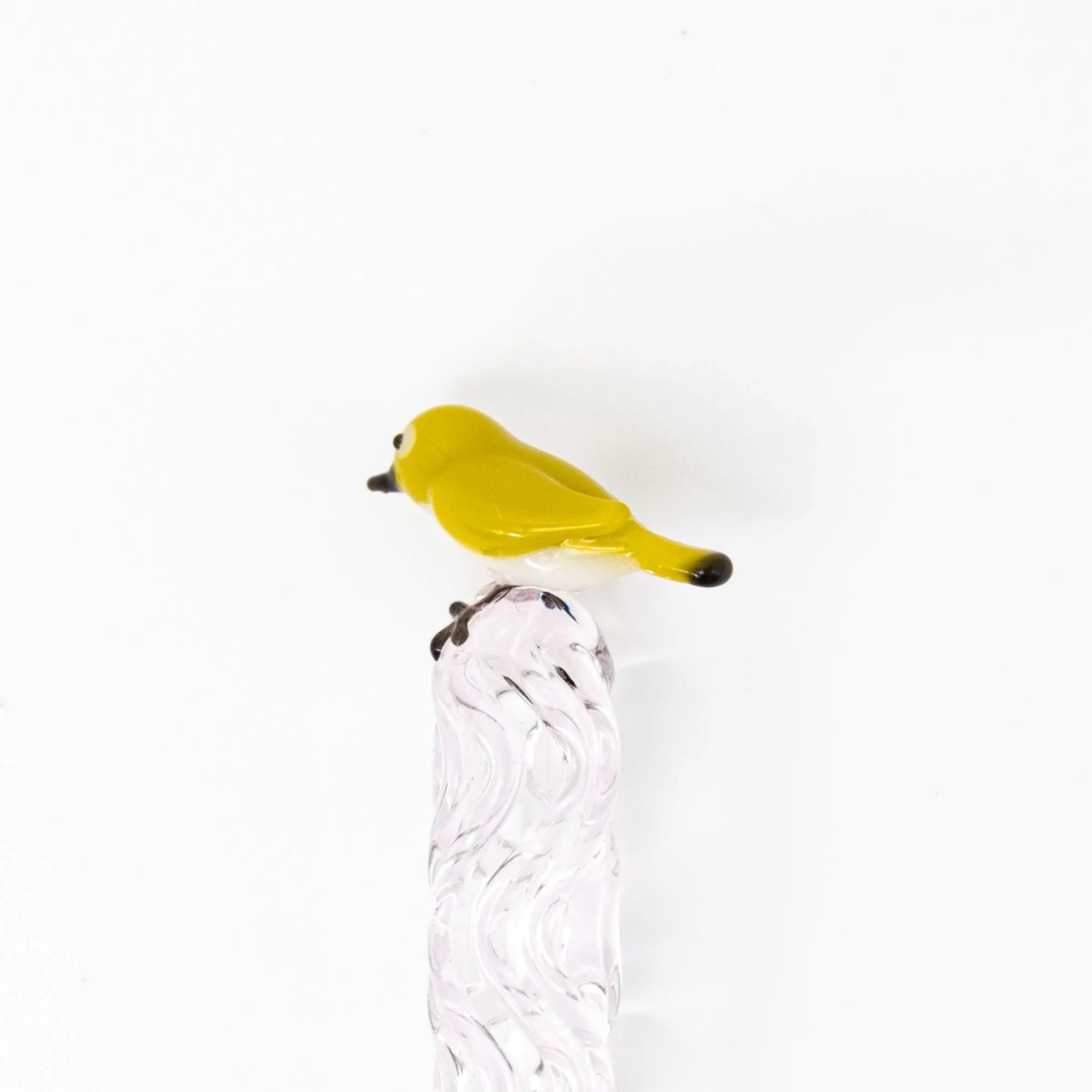 White-eye glass dip pen actively used for calligraphy displaying mejiro bird design and smooth ink flow with holder