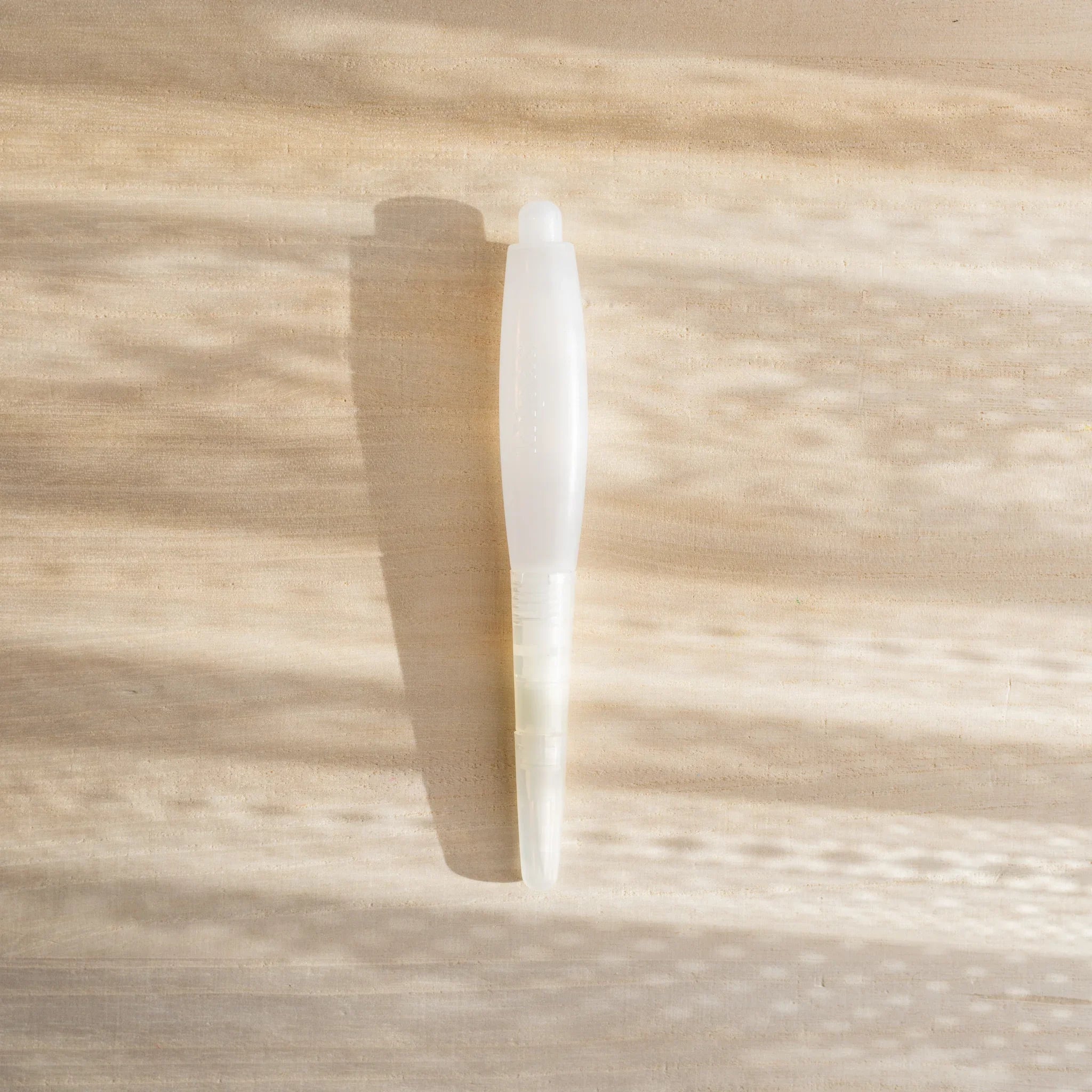 Kitpas watercolor crayons water brush pen shown alone on a clean background, with clear water reservoir and fine brush tip