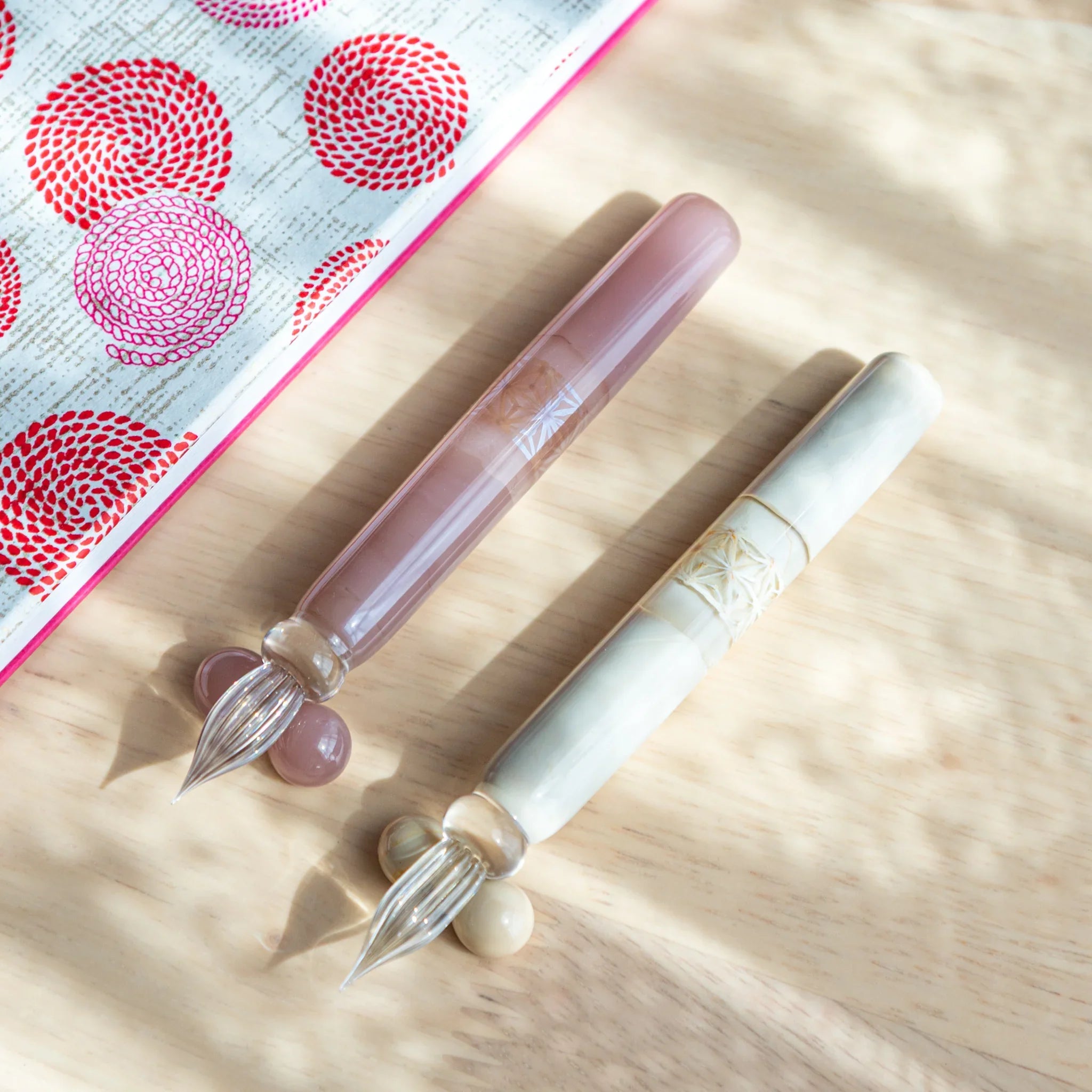 White hemp leaves glass dip pen complete set including wooden pen rests in natural flat lay composition