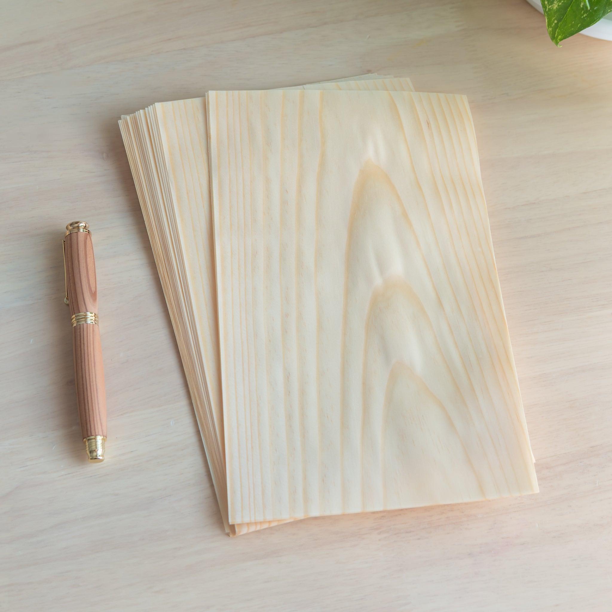 Stack of Wooden Sheet Loose Leaf Paper showing the beautiful wood grain pattern and smooth texture.