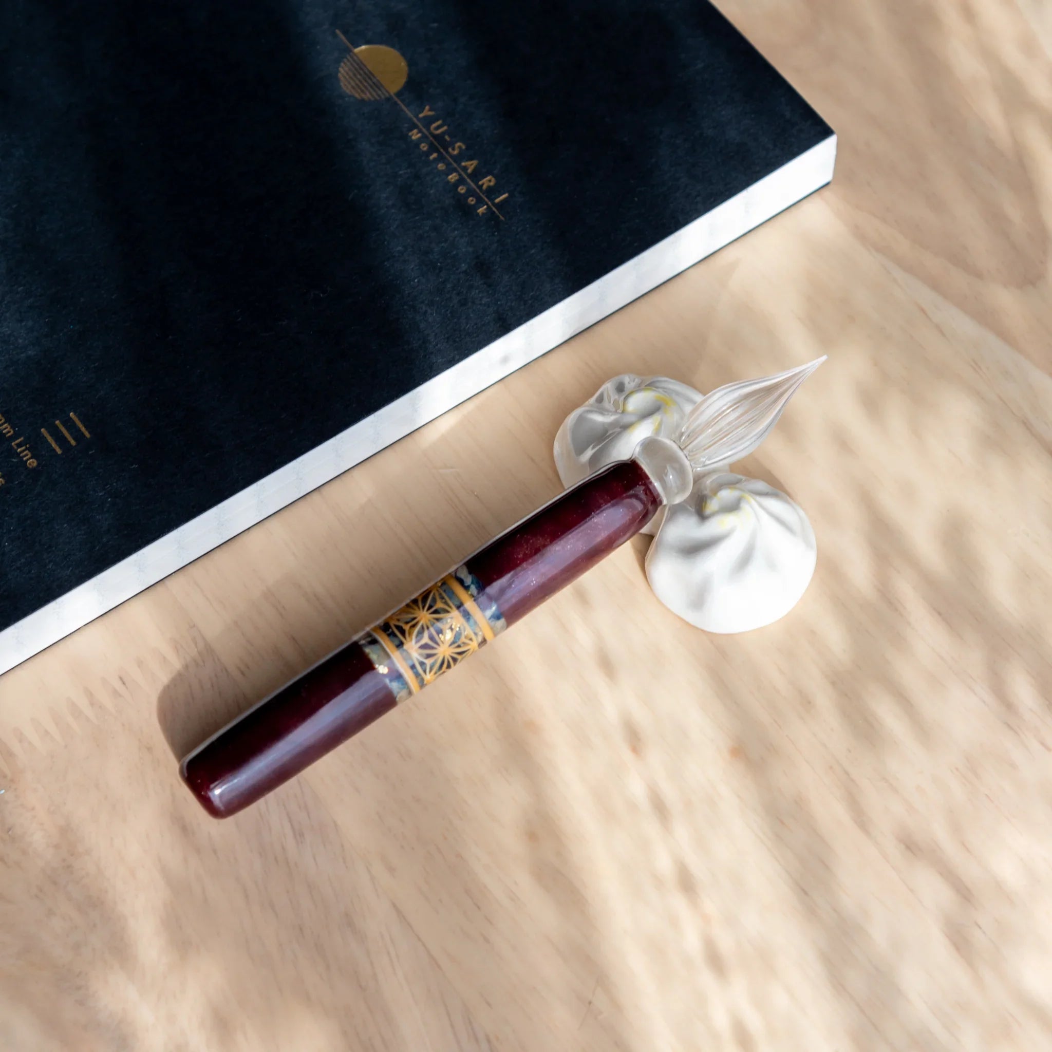 White xiaolongbao Japanese handcrafted ceramic pen rest with detailed pleats and traditional craftsmanship detail